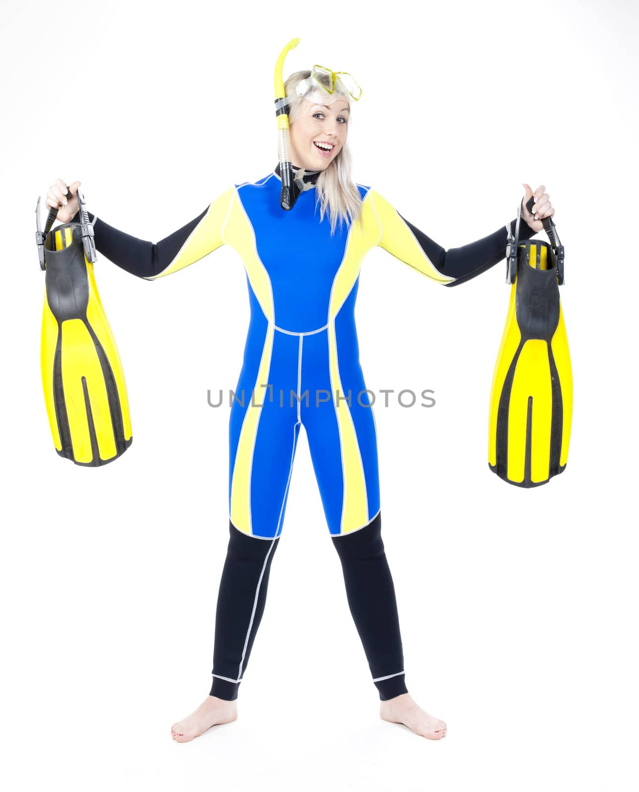 standing young woman wearing neoprene with snorkeling equipment by phbcz