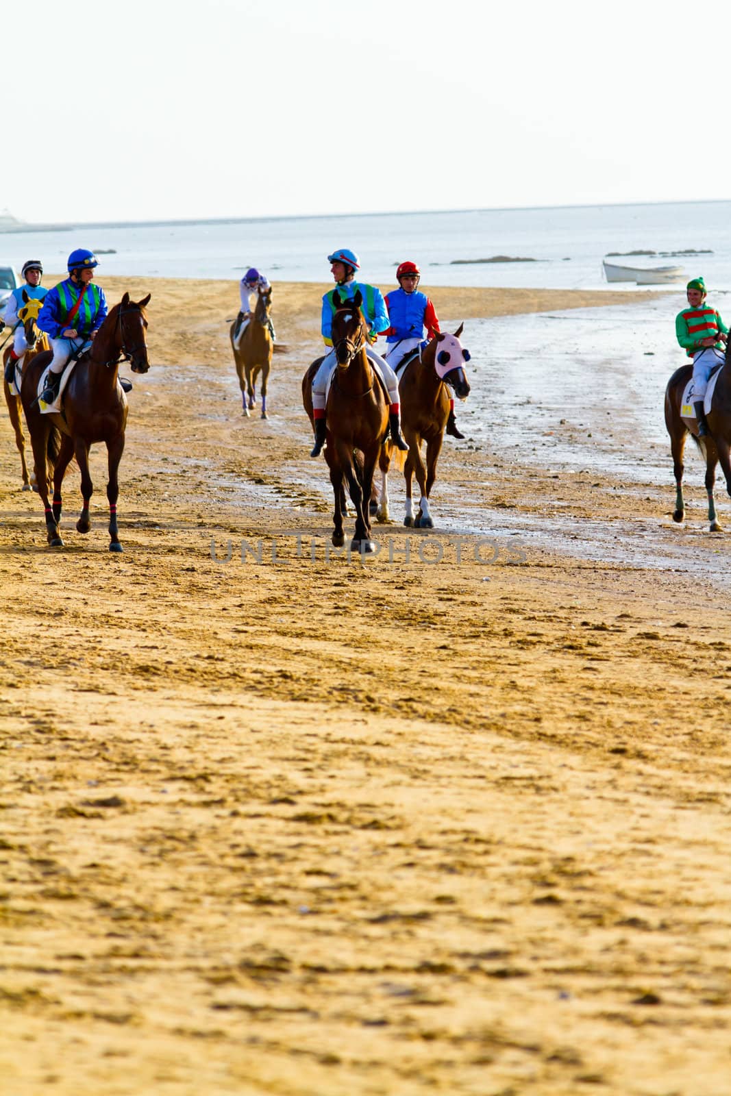 SANLUCAR DE BARRAMEDA, CADIZ, SPAIN - AUGUST 10: Unidentified rider at the start of race horses on Sanlucar de Barrameda beach on August 10, 2011 in Sanlucar de Barrameda, Cadiz, Spain.