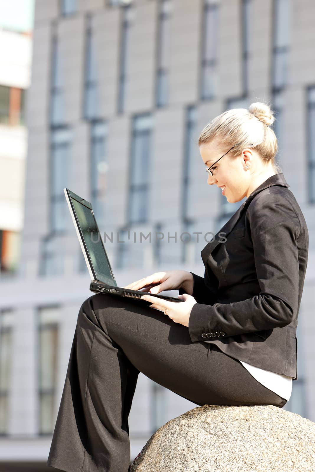 sitting young businesswoman with a notebook