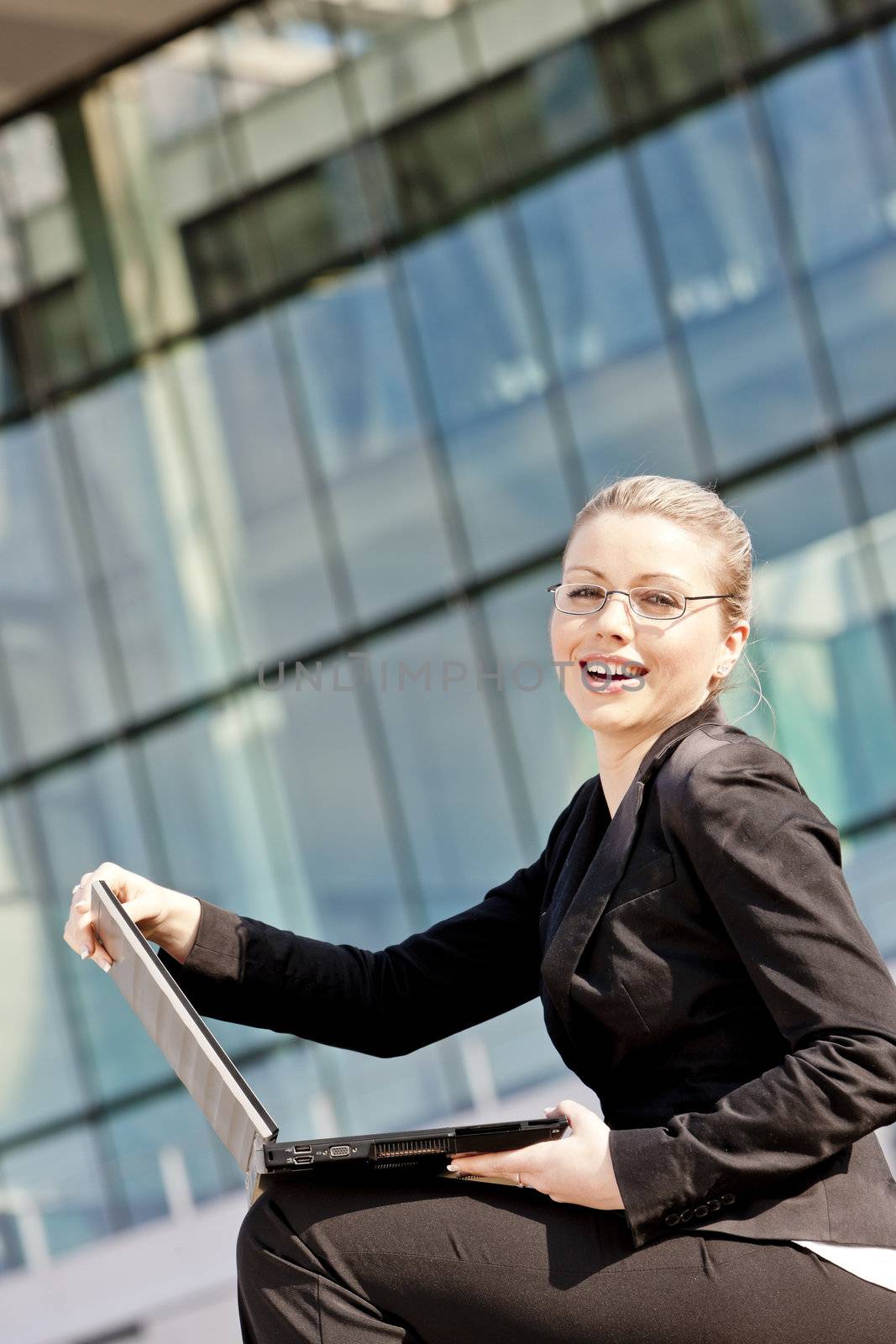 sitting young businesswoman with a notebook