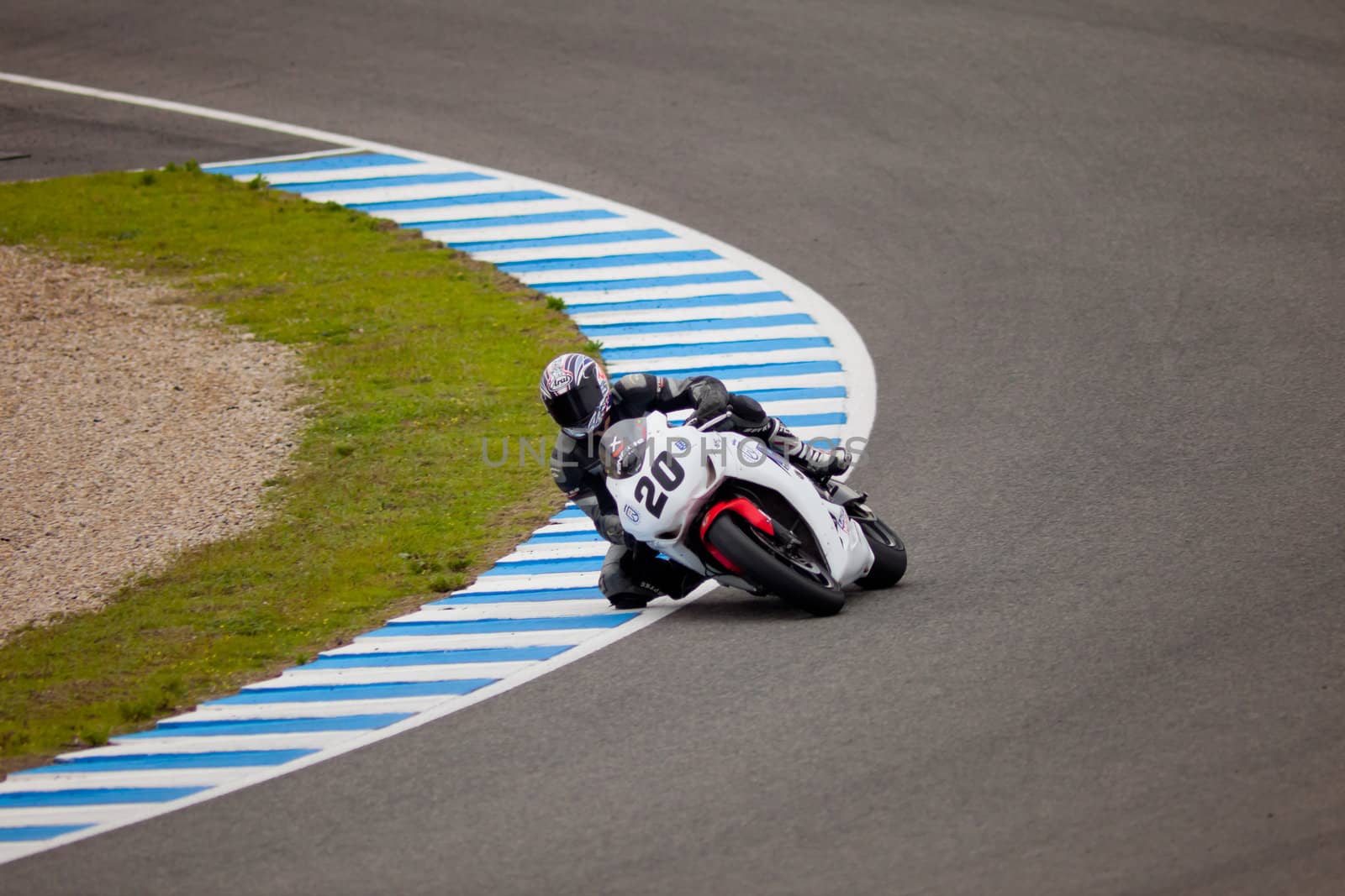 JEREZ DE LA FRONTERA, SPAIN - NOV 20: Stock Extreme motorcyclist Juan Alonso takes a curve in the CEV championship on Nov 20, 2010, in Jerez de la Frontera, Spain
