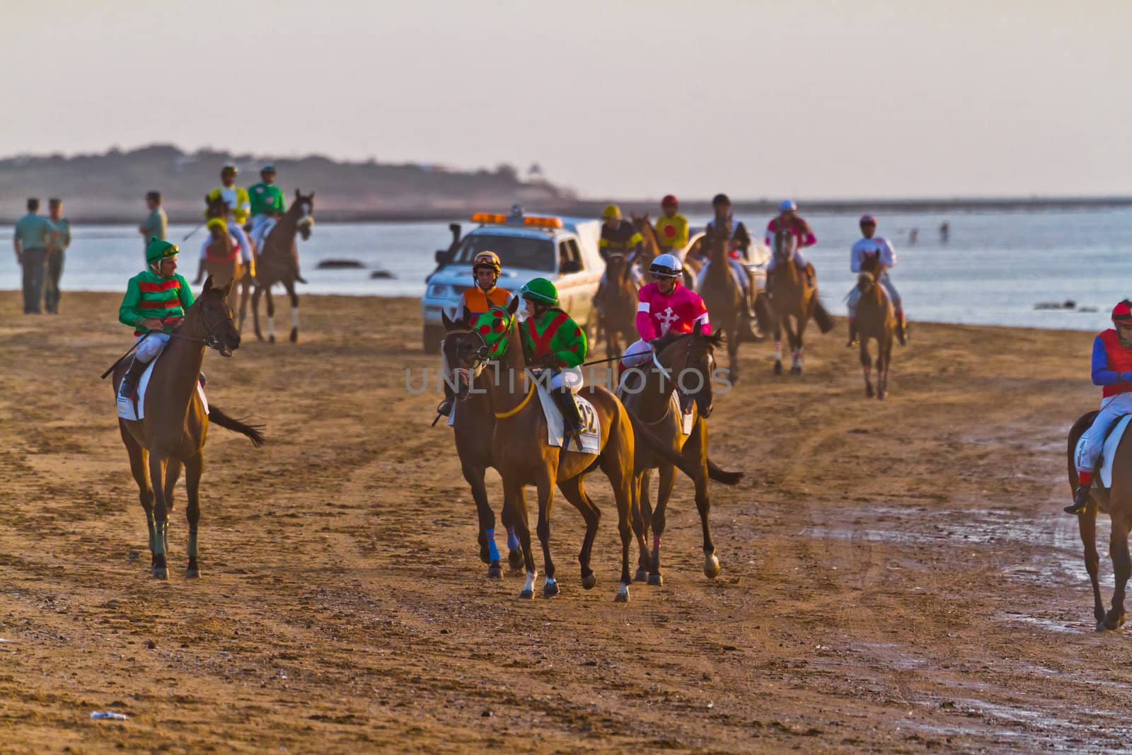 SANLUCAR DE BARRAMEDA, CADIZ, SPAIN - AUGUST 10: Unidentified riders at the start of race horses on Sanlucar de Barrameda beach on August 10, 2011 in Sanlucar de Barrameda, Cadiz, Spain.