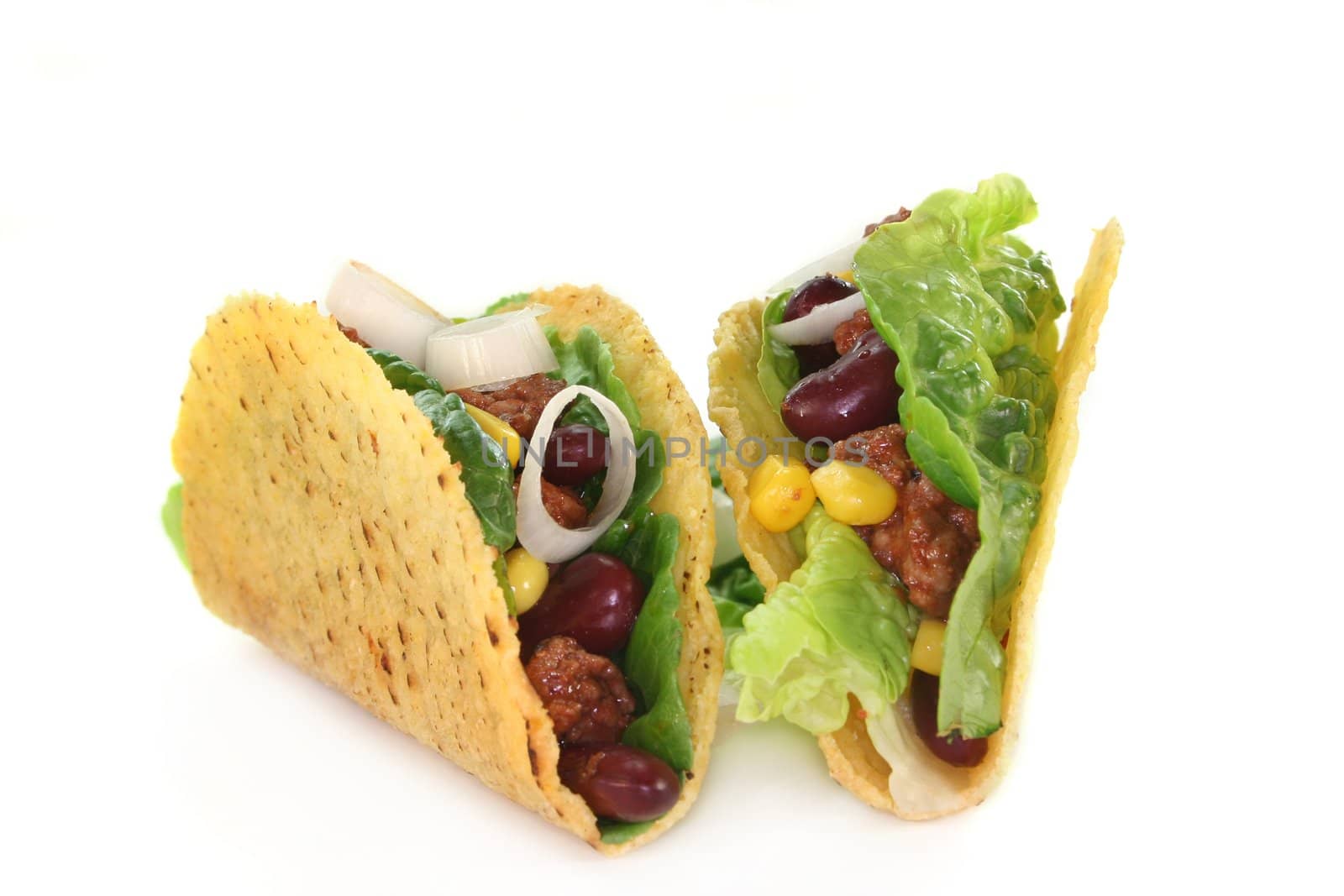 Taco shells filled with ground beef, kidney beans and corn

