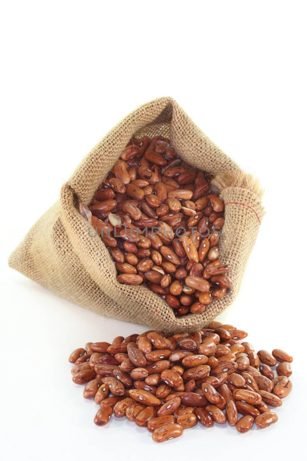 dried pinto beans in a jute sack
