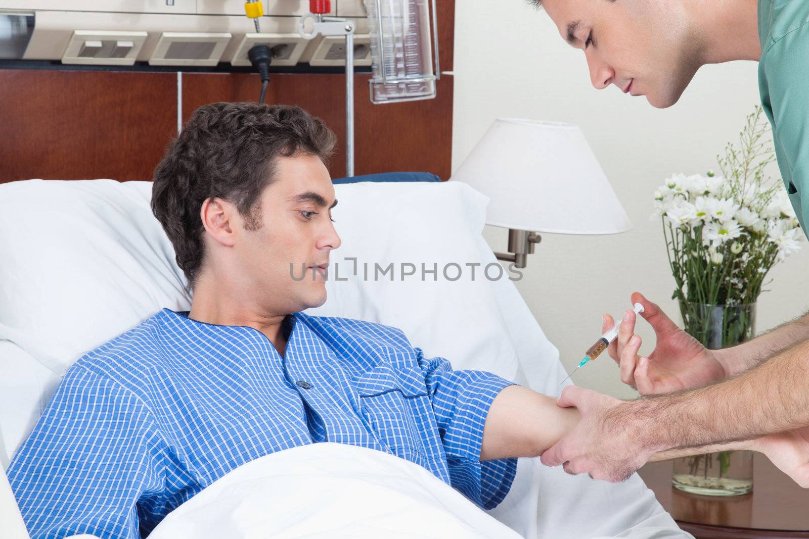 Worried patient looking at doctor giving injection