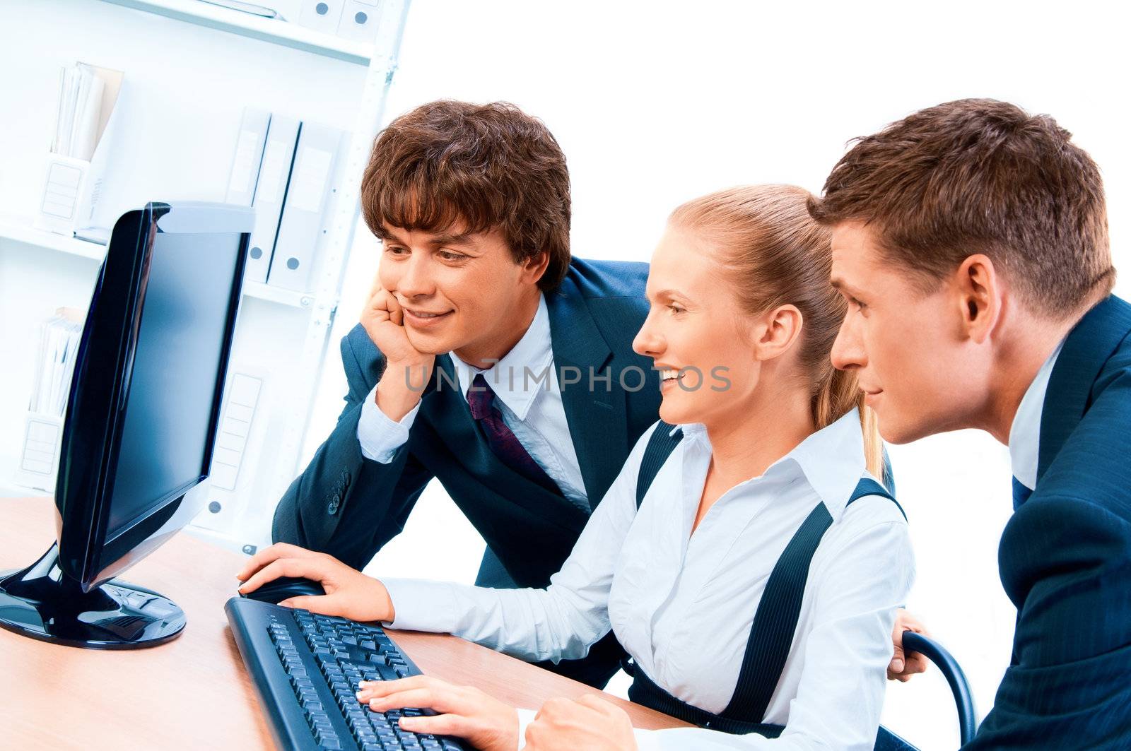Three young successful businesspeople. Screen has a clipping path.