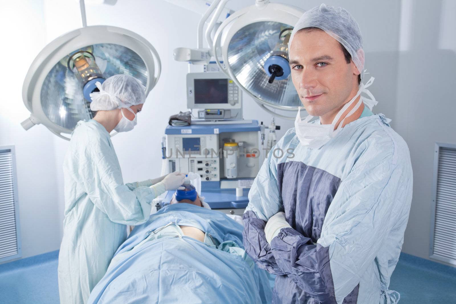 Confident surgeon in operating room by leaf