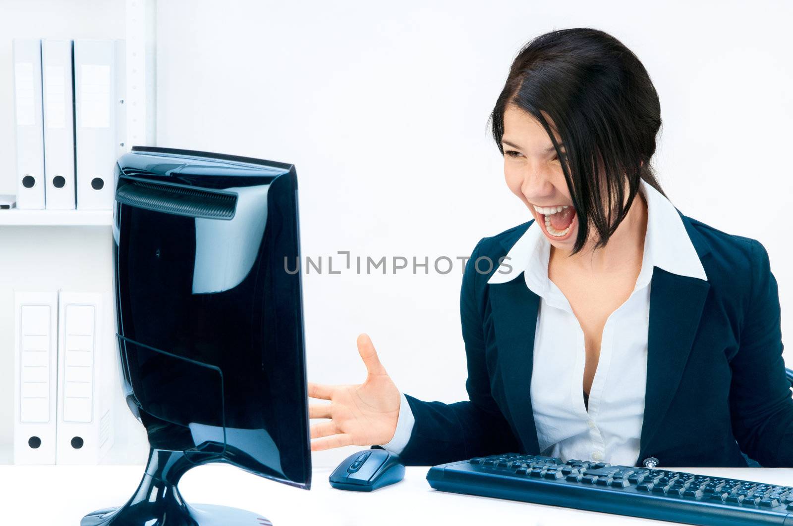 Business woman yelling at the monitor.