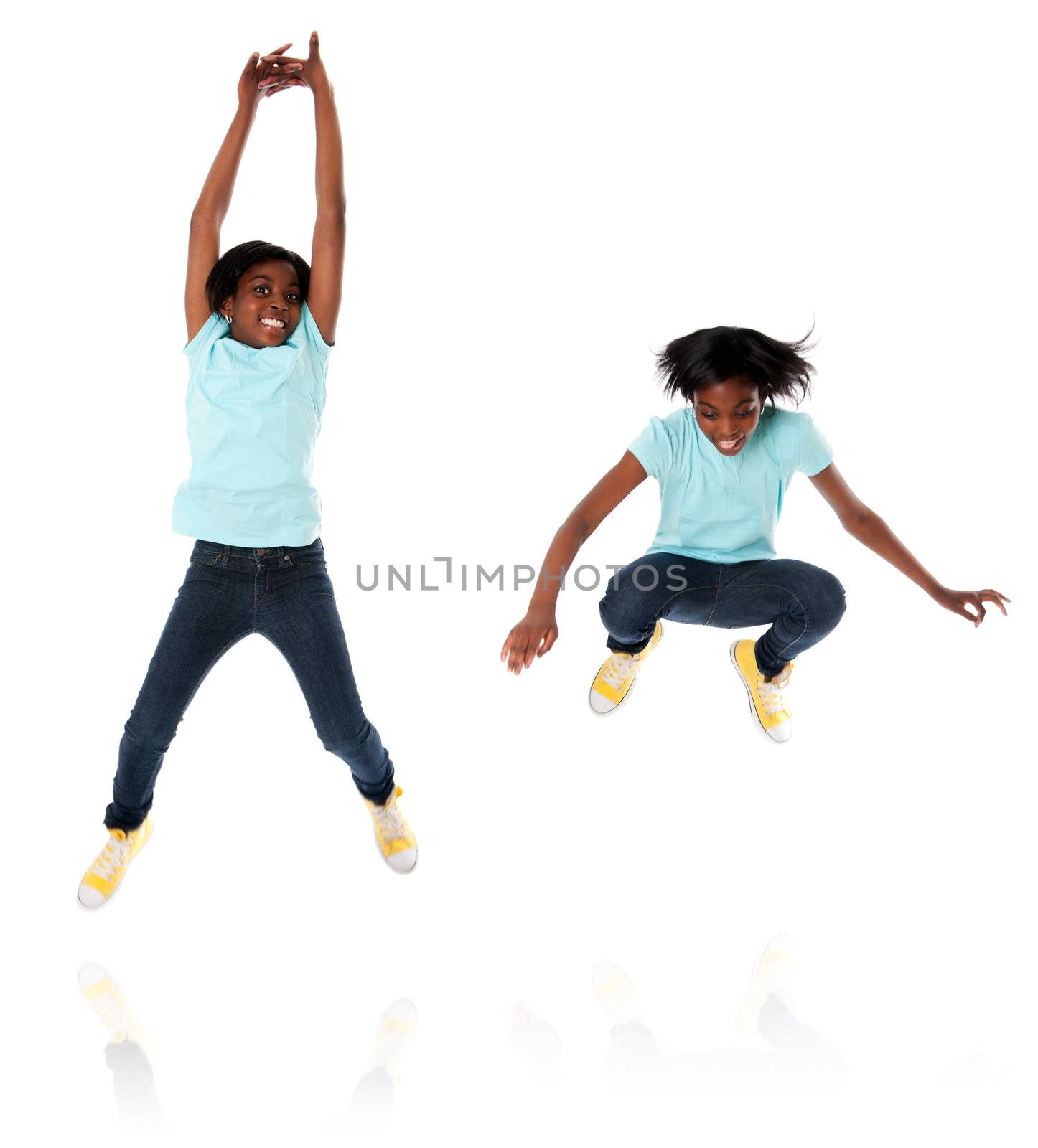 Happy child teenager jumping high in two different poses, isolated.
