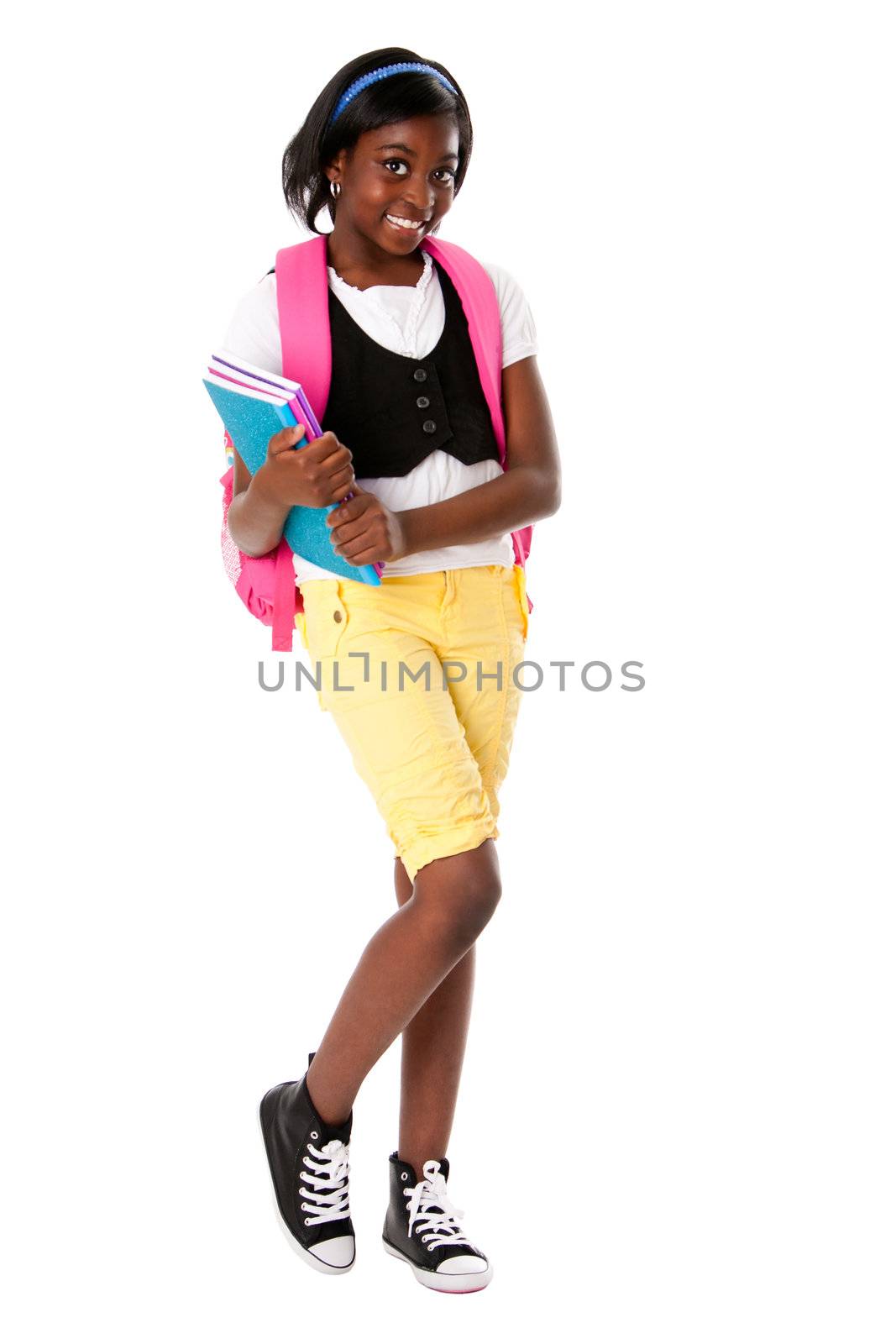 Cute happy child teenager student with colorful notebooks and backpack standing, isolated.