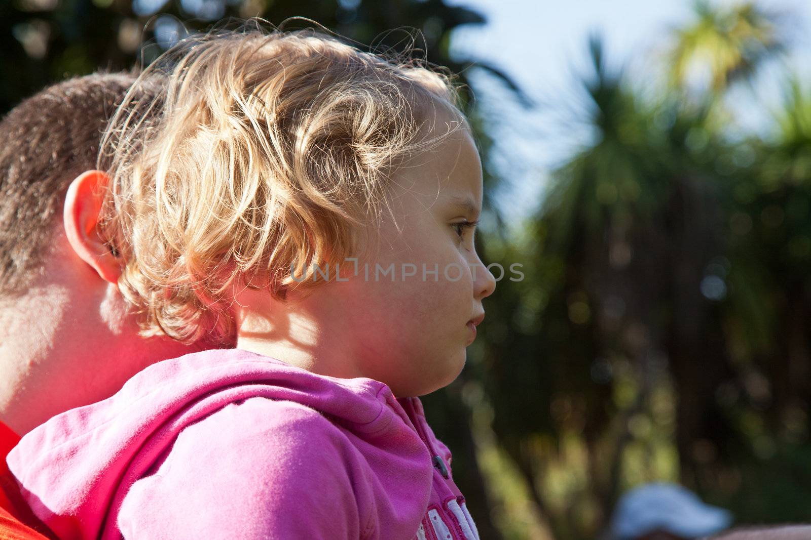 Father with little daughter exploring outdoors together.