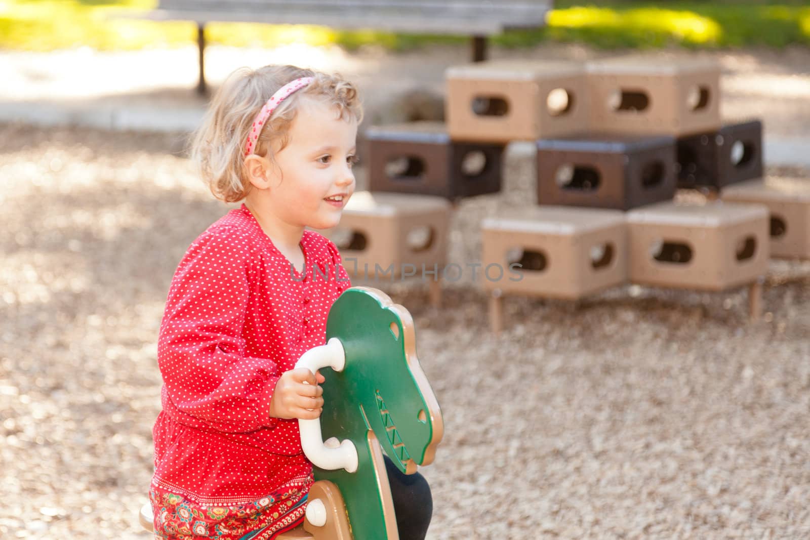 Having fun at playground in the park on Sunday afternoon.