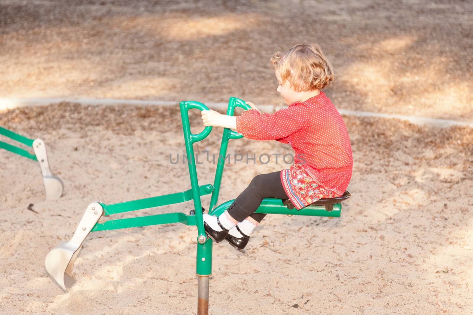 Having fun at playground in the park on Sunday afternoon.