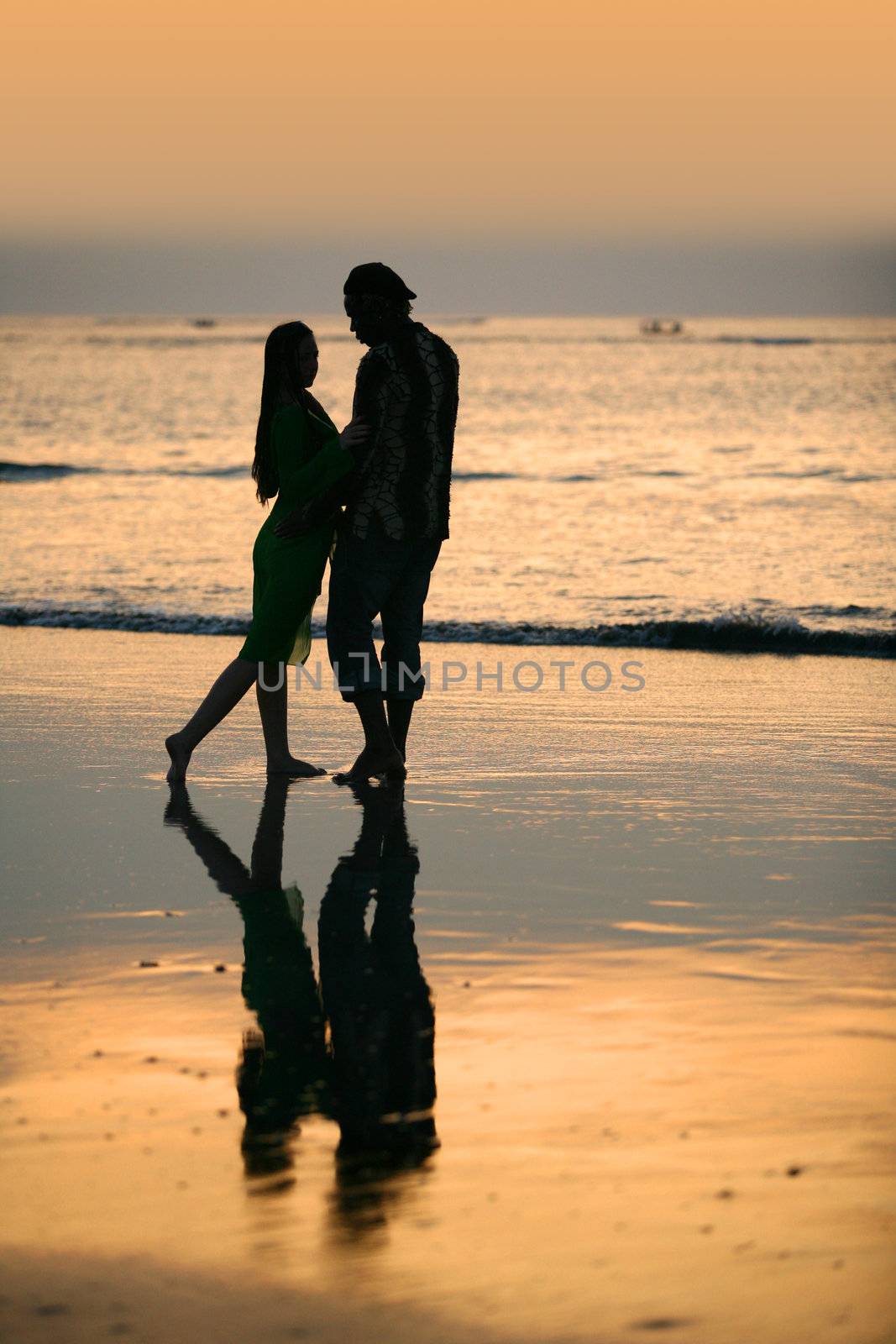 Couple on sunset. Coast of the Indian ocean