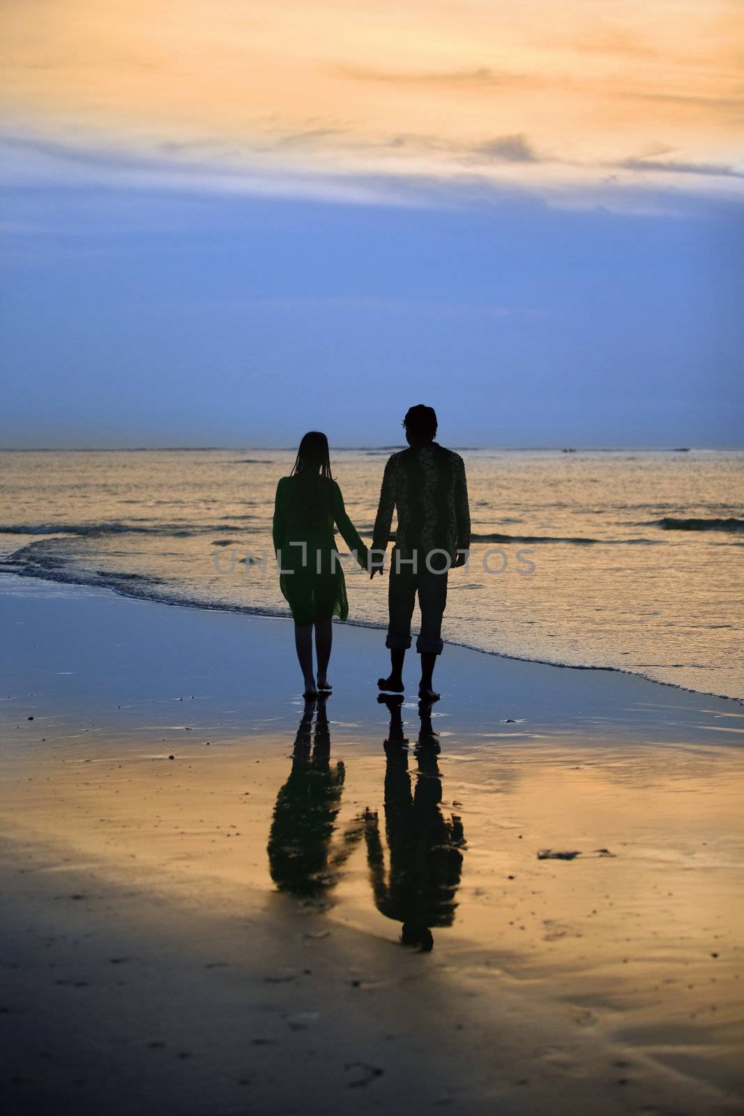 Couple on sunset. Coast of the Indian ocean