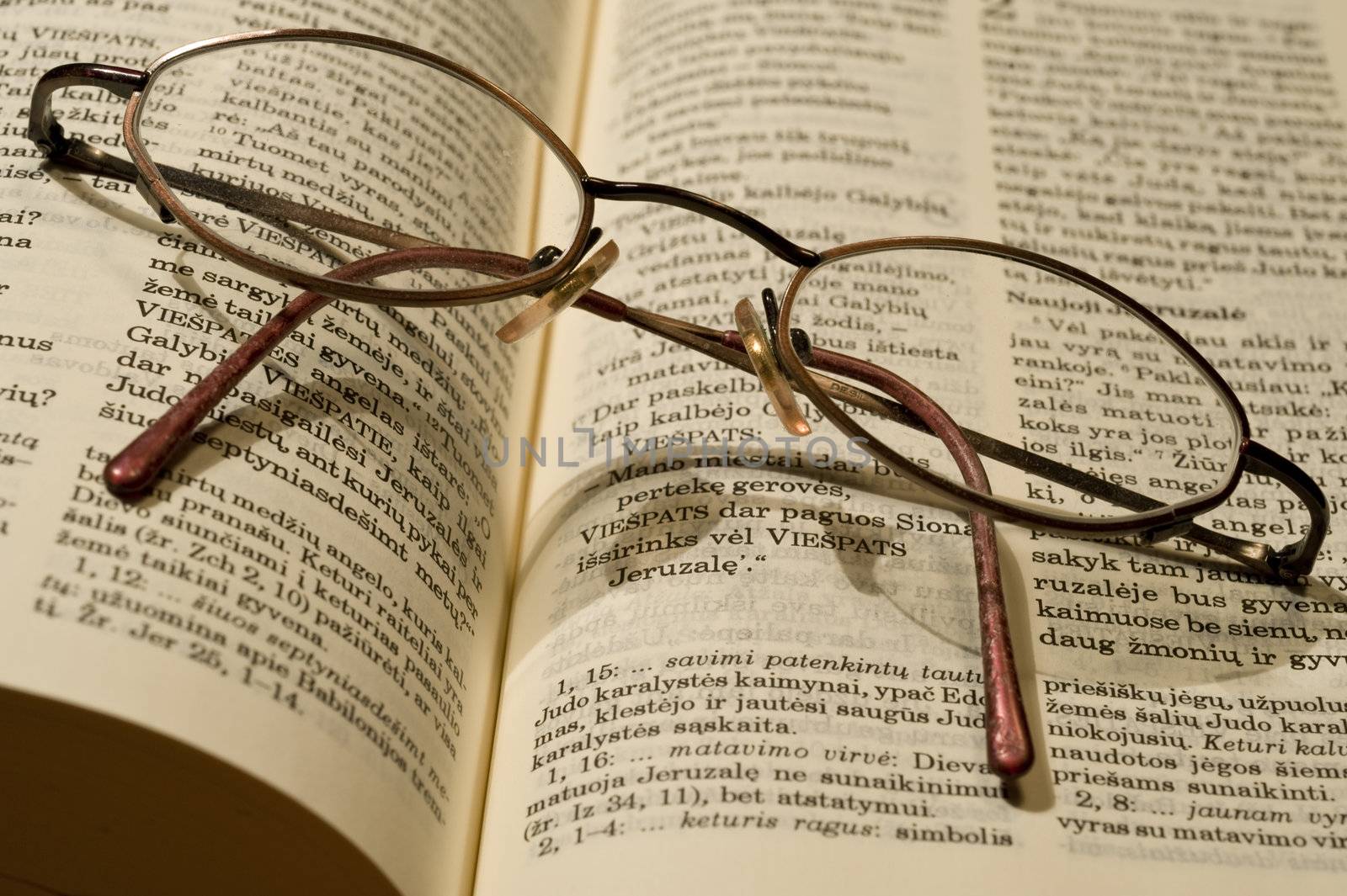 Bible book in the Swedish languageand glasses taken as macro