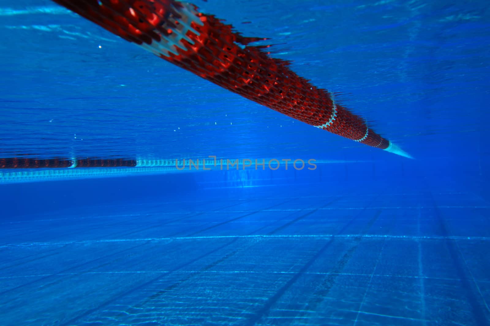 underwater view from a swimming pool with red marking