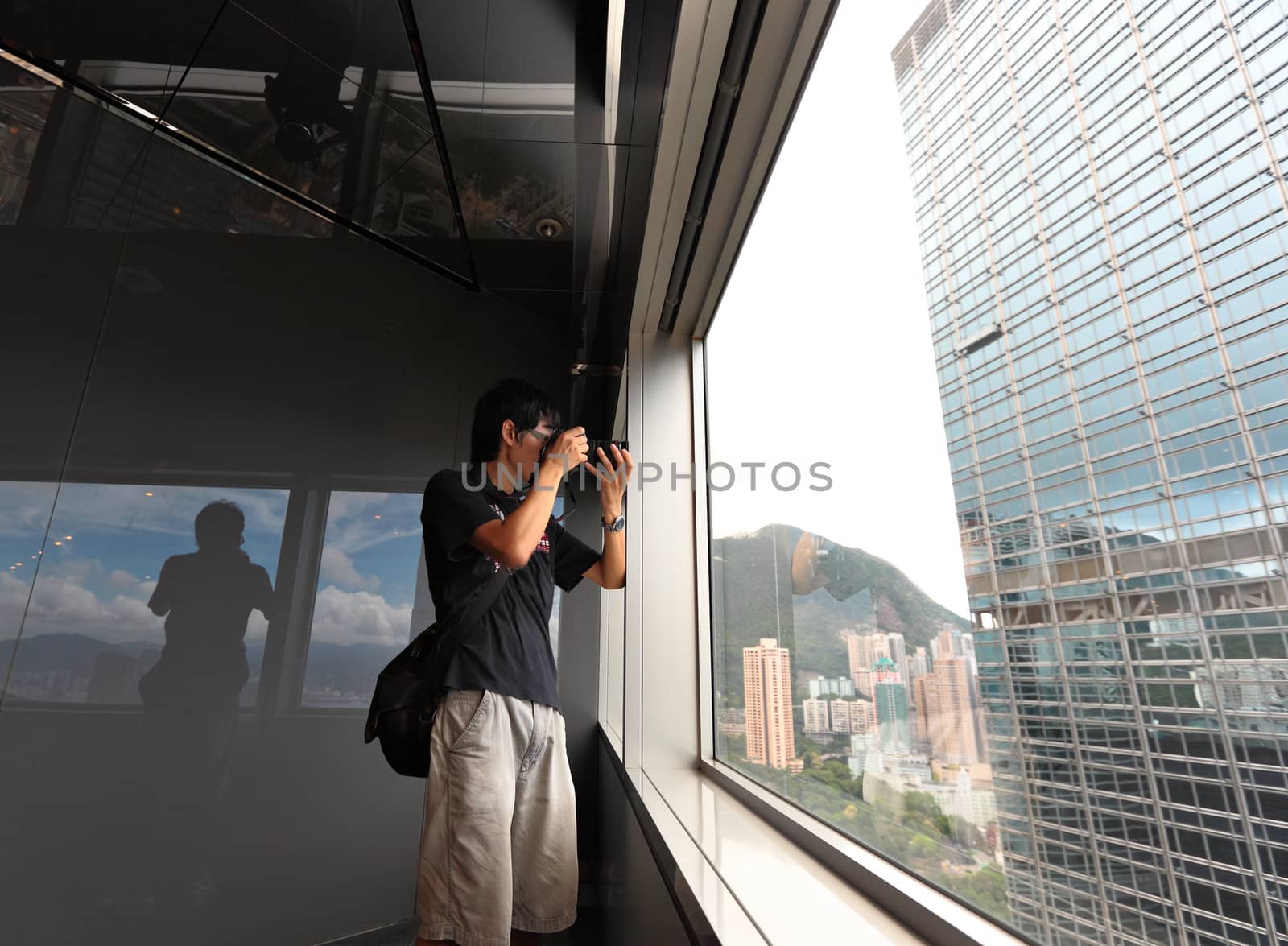 man on observation deck in Hong Kong