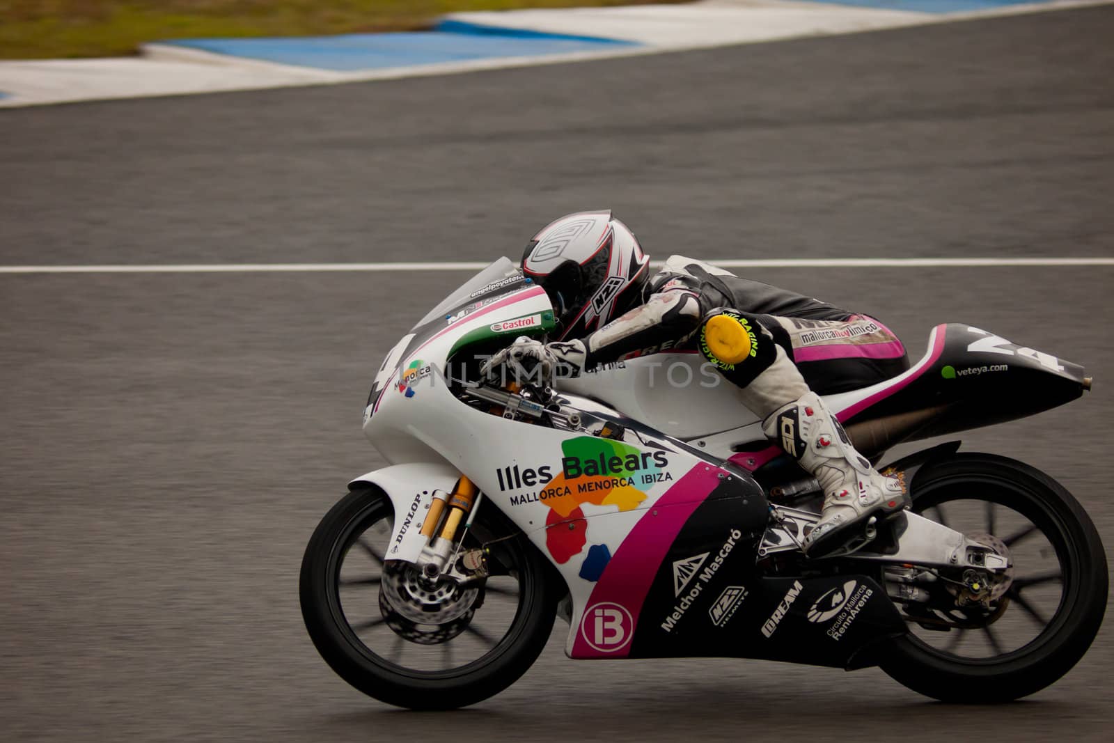 JEREZ DE LA FRONTERA, SPAIN - NOV 20: 125cc motorcyclist Miguel Poyatos Alarcon races in the CEV championship on Nov 20, 2010, in Jerez de la Frontera, Spain