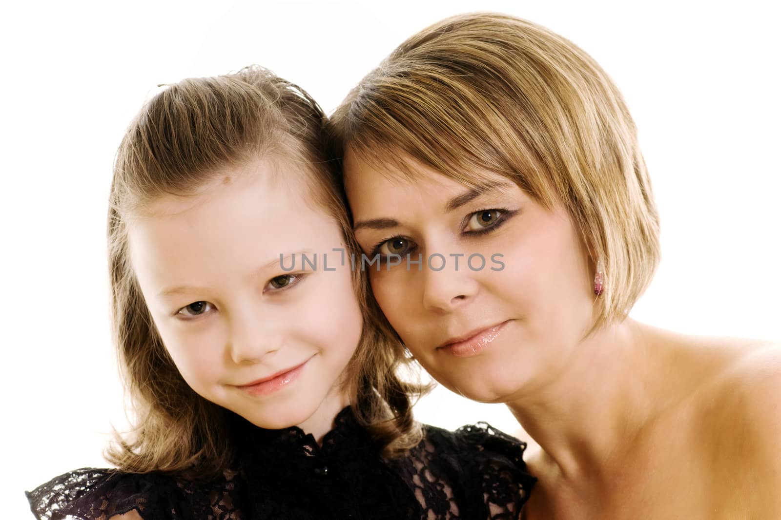studio portrait of a mother and daughter isolated on white