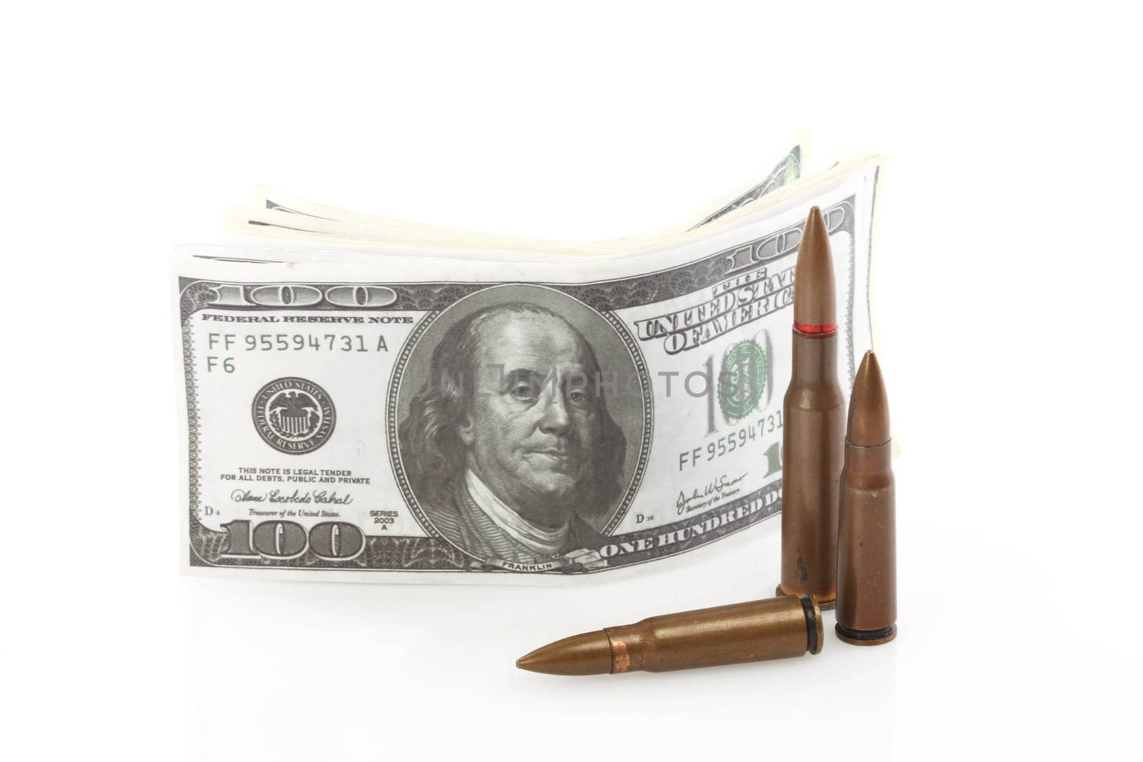 bullets close up over dollar bills