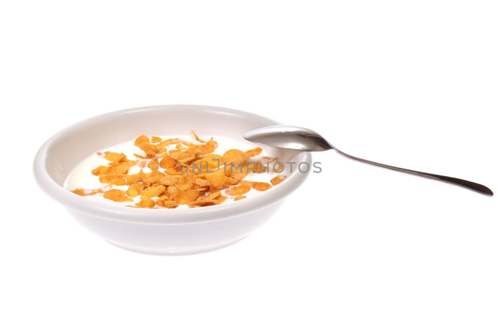 Bowl with corn flakes and milk, photo on white