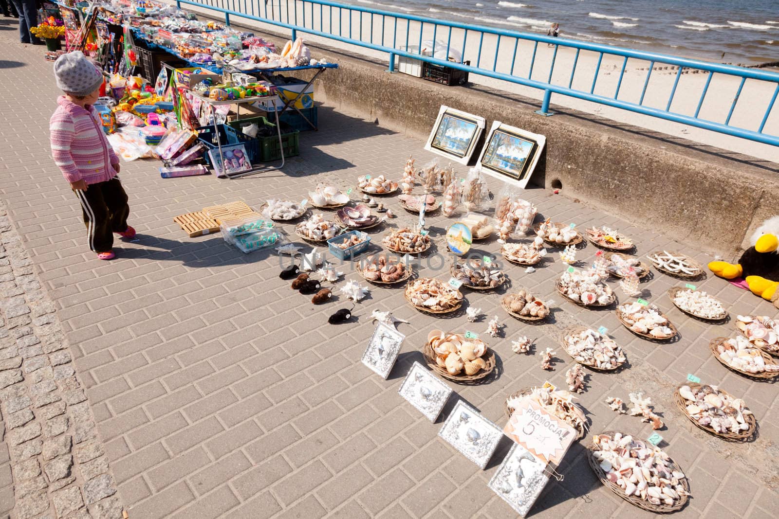 Colofulr souvenir displays on Kolbrzeg Promenade waiting for tourists.