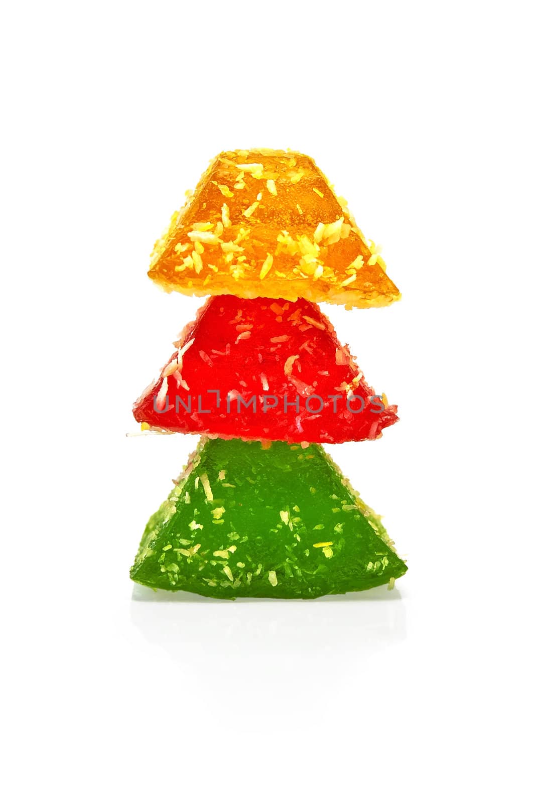 Three marmalade of red, green and yellow, folded on each other is isolated on a white background