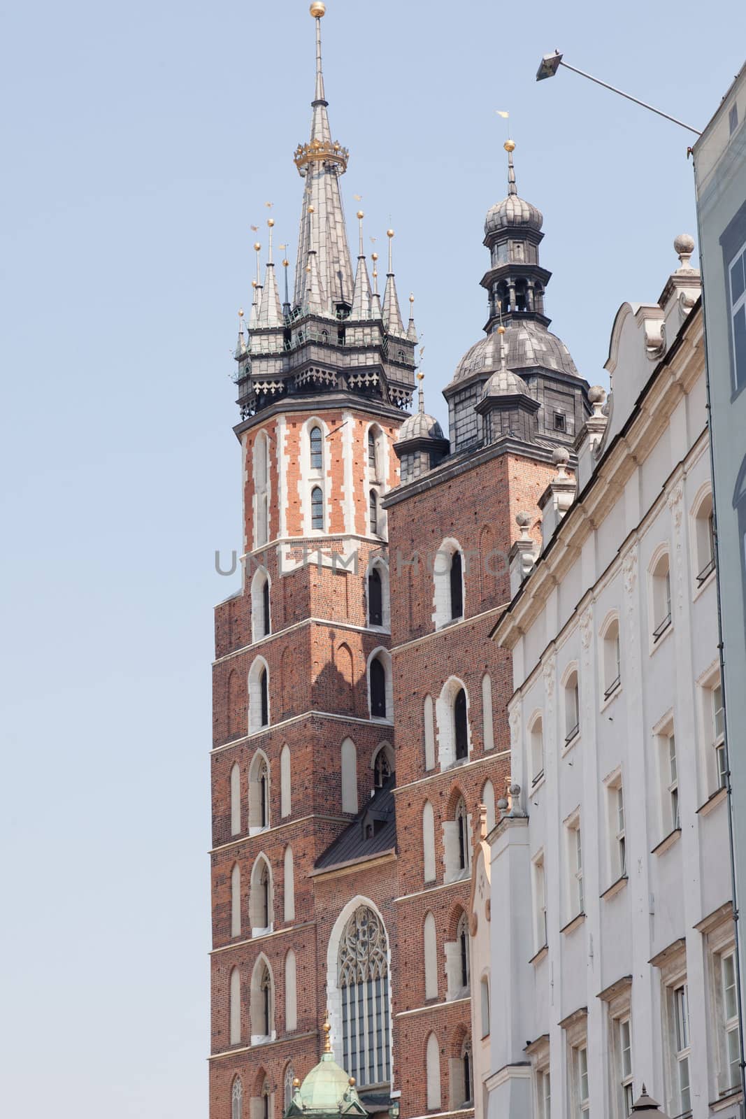 St. Mary's Basilica is a Brick Gothic church re-built in the 14th century (originally built in the early 13th century), adjacent to the Main Market Square in Kraków, Poland.