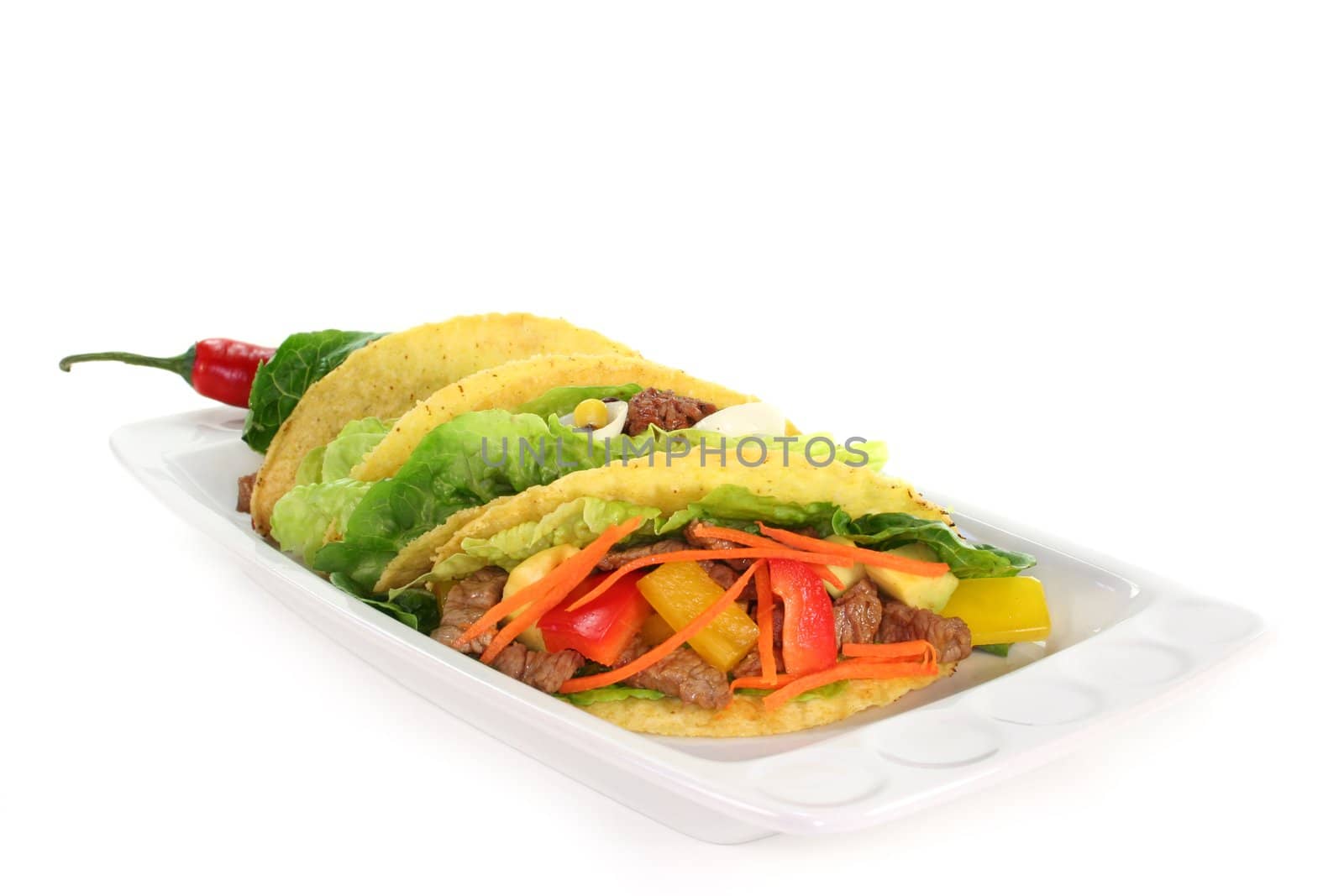 Taco shells filled with beef strips and vegetables