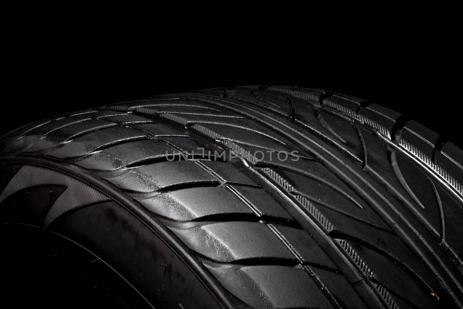 car tire, photo on the black background