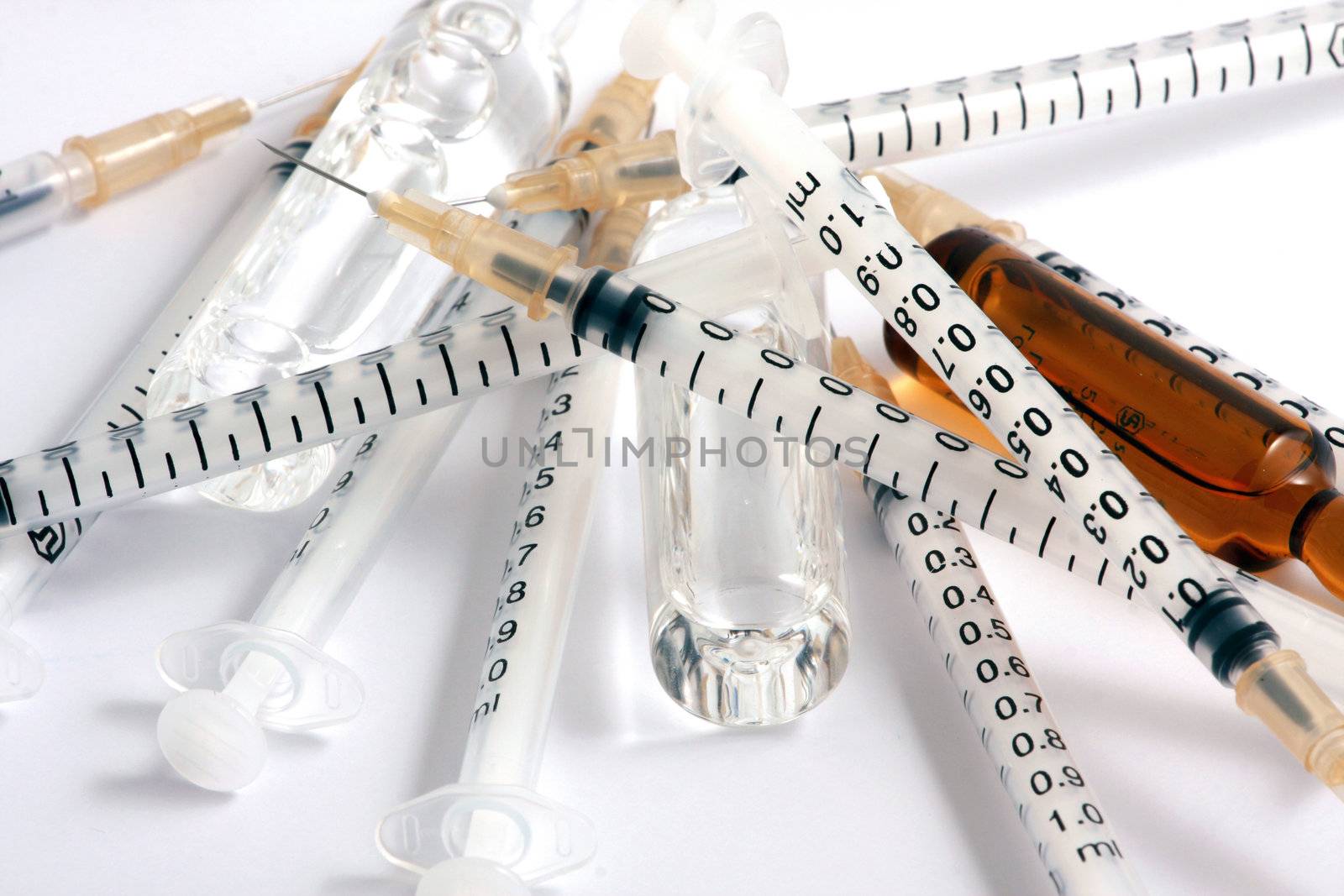 Syringes on white background