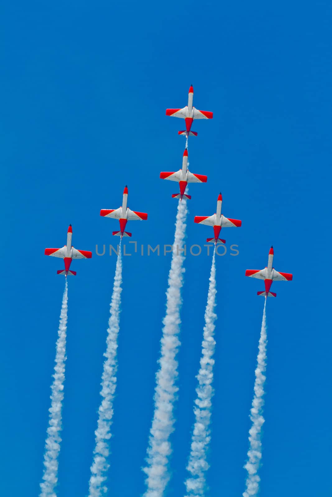 CADIZ, SPAIN-SEP 9: Aircrafts of the Patrulla Aguila taking part in a test on the 4th airshow of Cadiz on Sep 9, 2011, in Cadiz, Spain