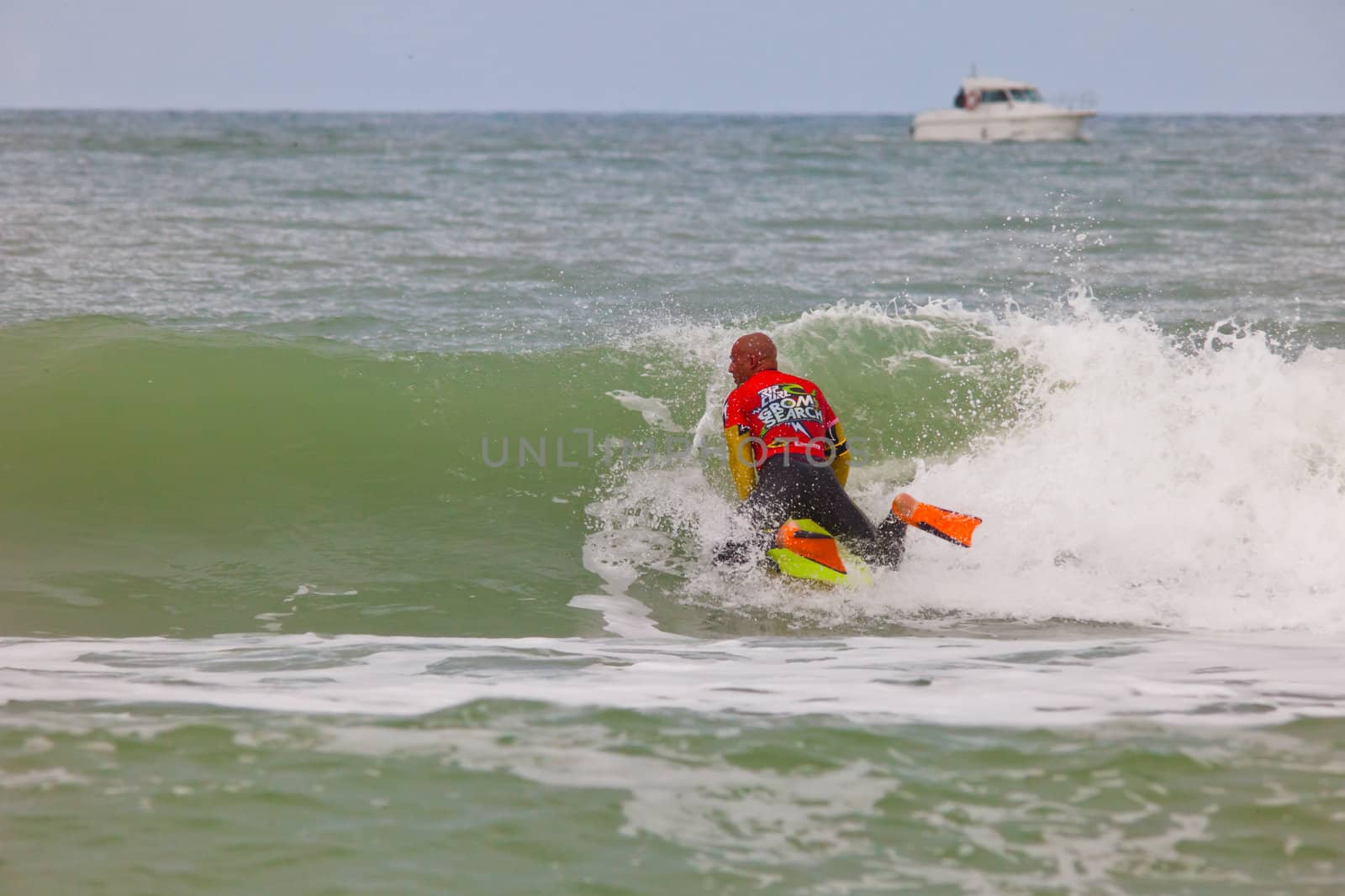 SAN FERNANDO, CADIZ, SPAIN - FEB 19: Unknown bodyboader going to the water on the 2nd championship of Surf and BodyBoard Impoxibol on Feb 19,2011 on the beach of Camposoto of San Fernando, Cadiz, Spain