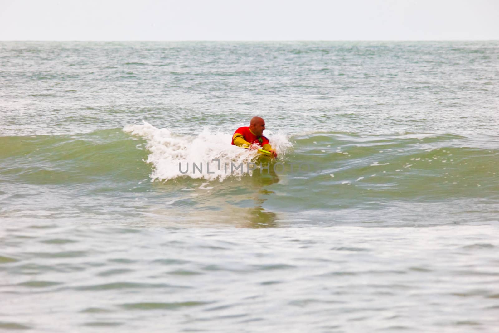 SAN FERNANDO, CADIZ, SPAIN - FEB 19: Unknown bodyboader going to the water on the 2nd championship of Surf and BodyBoard Impoxibol on Feb 19,2011 on the beach of Camposoto of San Fernando, Cadiz, Spain