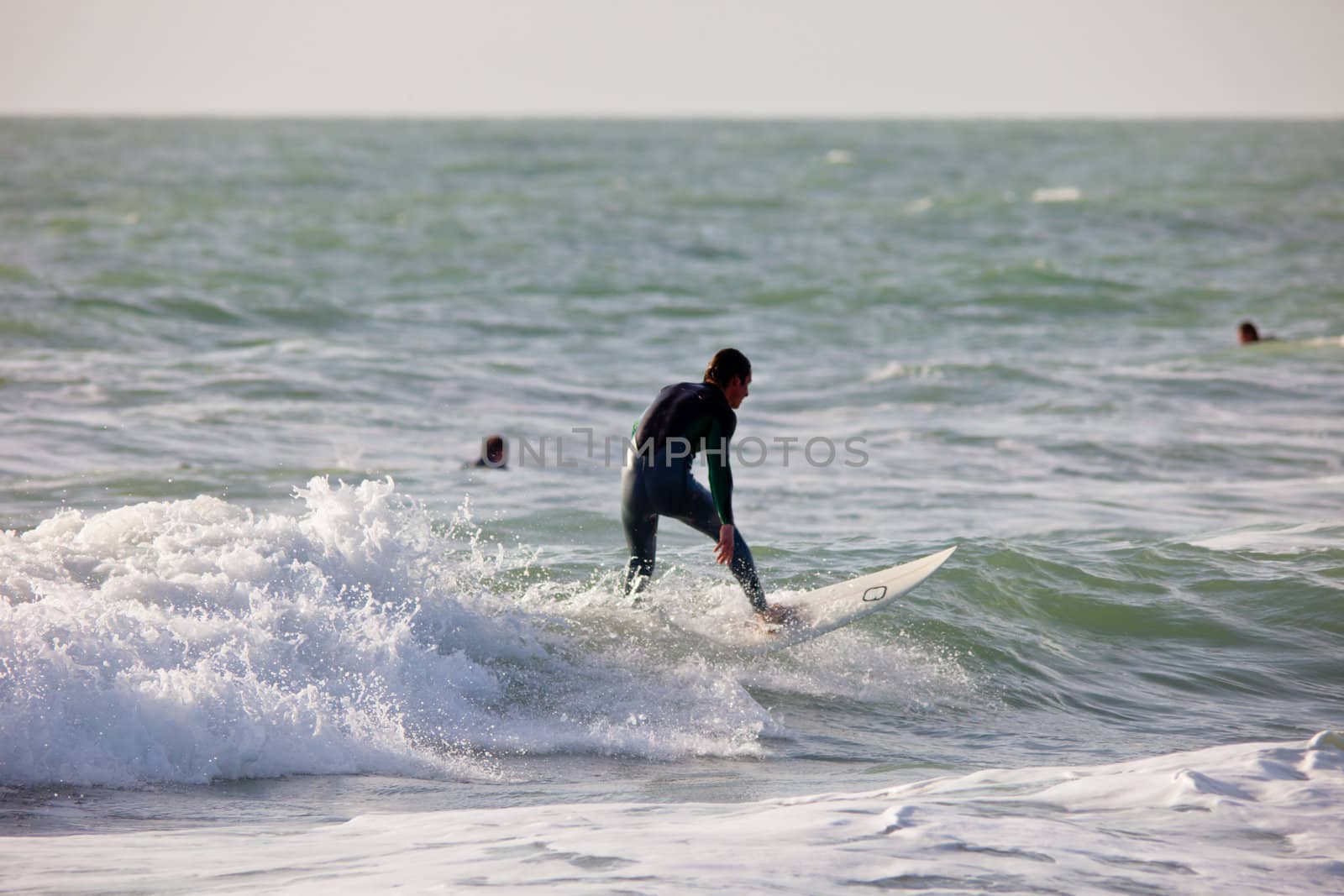 SAN FERNANDO, CADIZ, SPAIN - FEB 19: Unknown surfer taking waves on the 2nd championship of Surf and BodyBoard Impoxibol on Feb 19,2011 on the beach of Camposoto of San Fernando, Cadiz, Spain