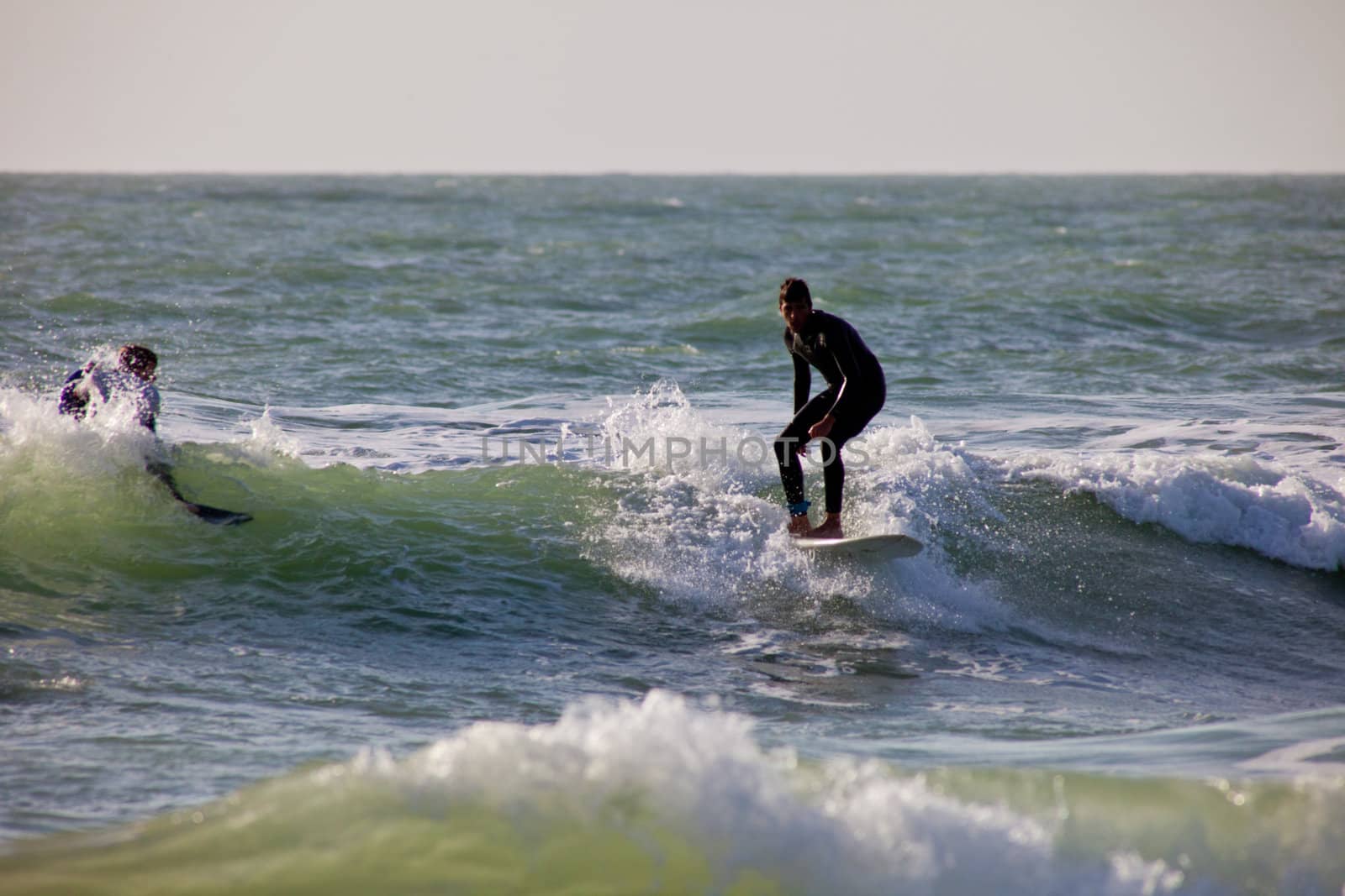 SAN FERNANDO, CADIZ, SPAIN - FEB 19: Unknown surfer taking waves on the 2nd championship of Surf and BodyBoard Impoxibol on Feb 19,2011 on the beach of Camposoto of San Fernando, Cadiz, Spain