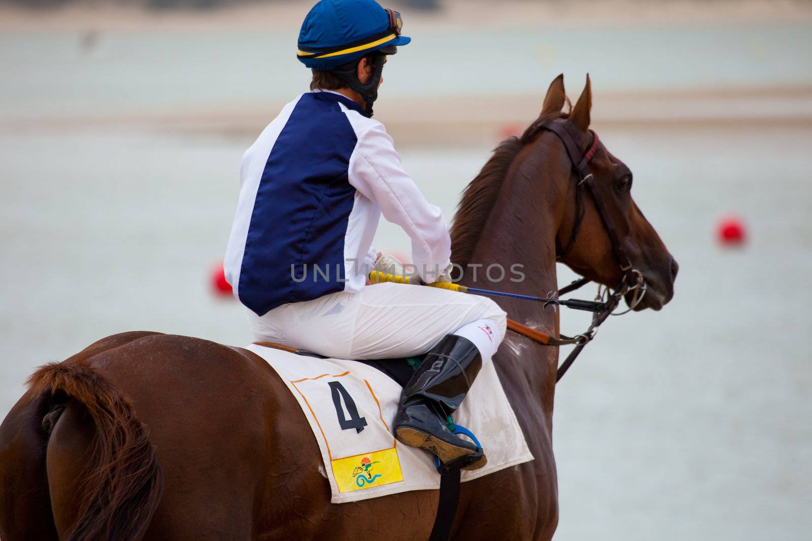 SANLUCAR DE BARRAMEDA, CADIZ, SPAIN - AUGUST 07: Unidentified rider at the start of race horses on Sanlucar de Barrameda beach on  August 07, 2010 in Sanlucar de Barrameda, Cadiz, Spain.