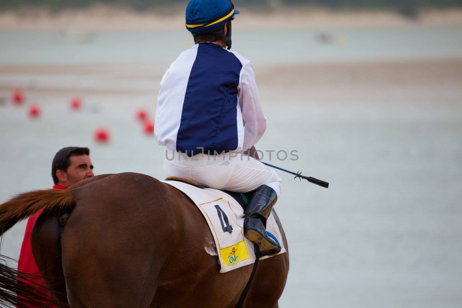 SANLUCAR DE BARRAMEDA, CADIZ, SPAIN - AUGUST 07: Unidentified rider at the start of race horses on Sanlucar de Barrameda beach on  August 07, 2010 in Sanlucar de Barrameda, Cadiz, Spain.