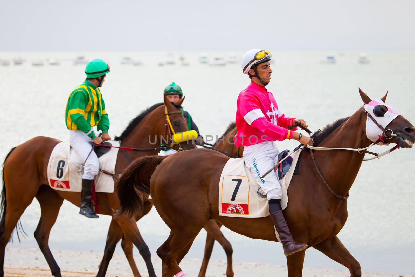 SANLUCAR DE BARRAMEDA, CADIZ, SPAIN - AUGUST 07: Unidentified riders at the start of race horses on Sanlucar de Barrameda beach on  August 07, 2010 in Sanlucar de Barrameda, Cadiz, Spain.