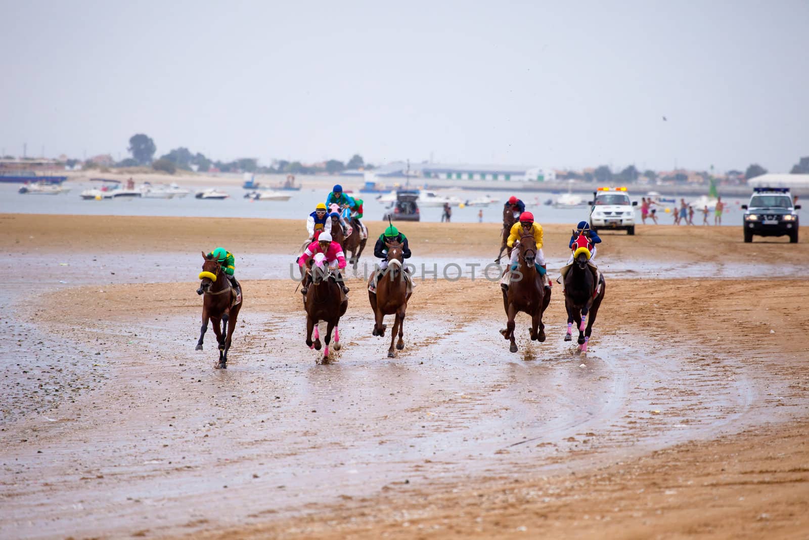 SANLUCAR DE BARRAMEDA, CADIZ, SPAIN - AUGUST 07: Unidentified riders at the start of race horses on Sanlucar de Barrameda beach on  August 07, 2010 in Sanlucar de Barrameda, Cadiz, Spain.