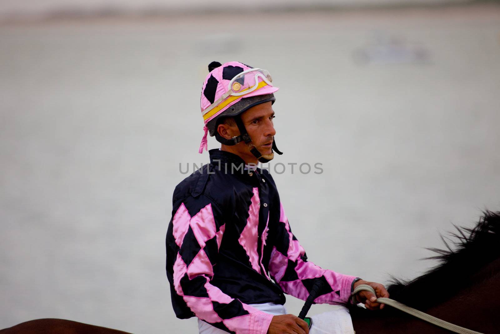 SANLUCAR DE BARRAMEDA, CADIZ, SPAIN - AUGUST 07: Unidentified riders at the start of race horses on Sanlucar de Barrameda beach on  August 07, 2010 in Sanlucar de Barrameda, Cadiz, Spain.