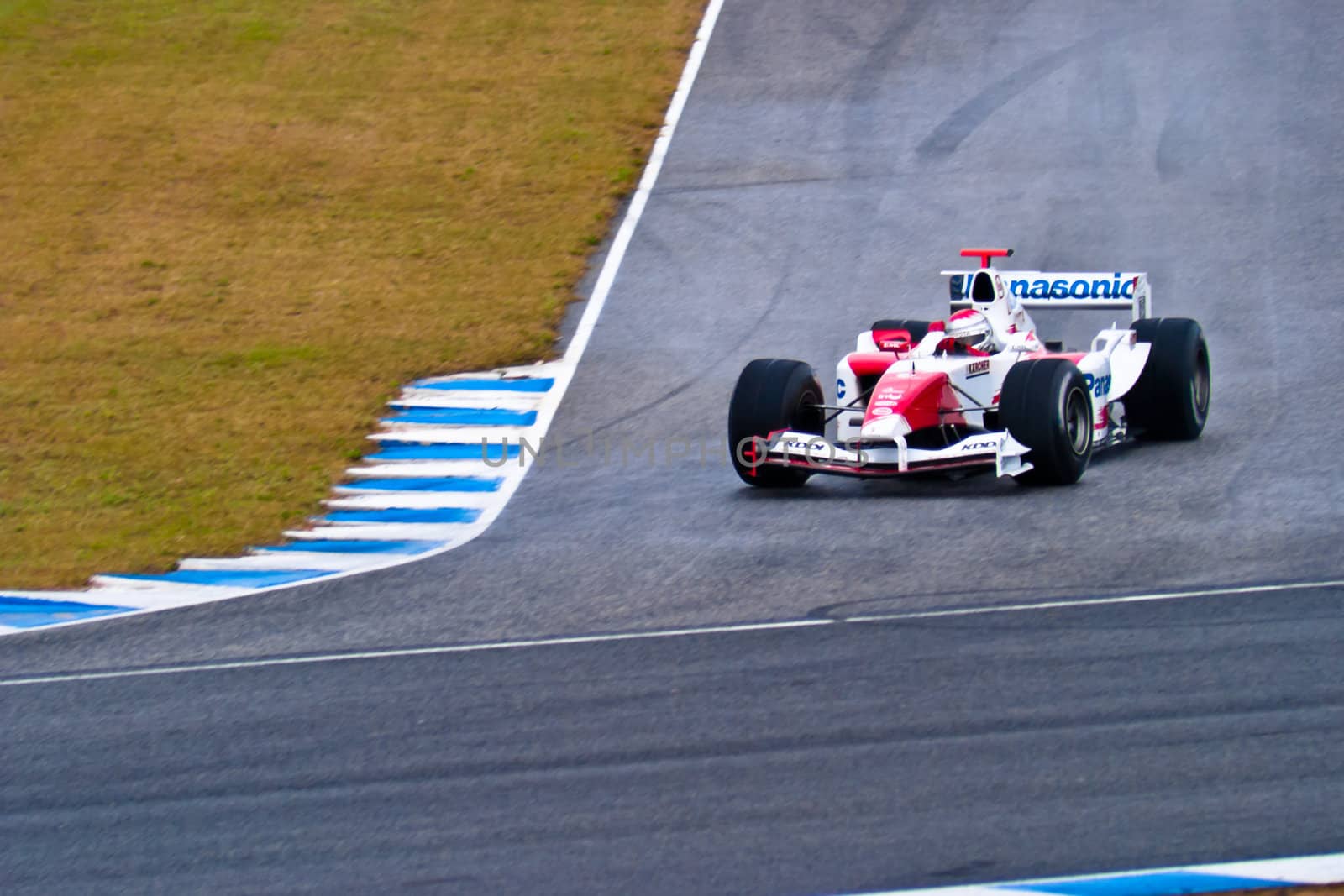 JEREZ DE LA FRONTERA, SPAIN - DEC 04: Jarno Trulli of Toyota F1 takes a curve during a training session on December 04, 2004, in Jerez de la Frontera, Spain