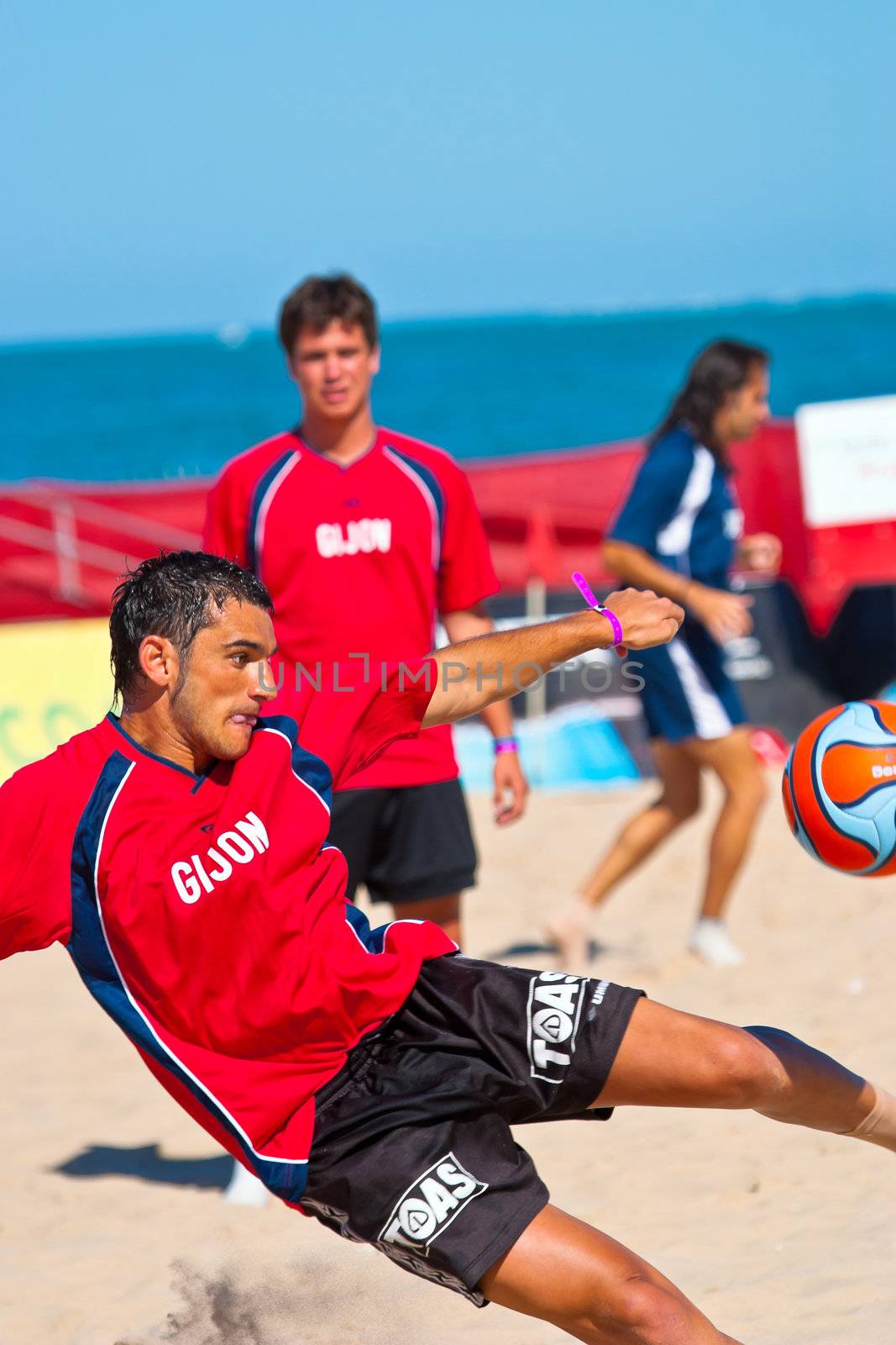 CADIZ, SPAIN -  JUL 30:  Unknown players of the team of Gijon playing the Spanish Championship of Beach Soccer on Jul 30, 2005 on the beach of La Victoria in Cadiz, Spain
