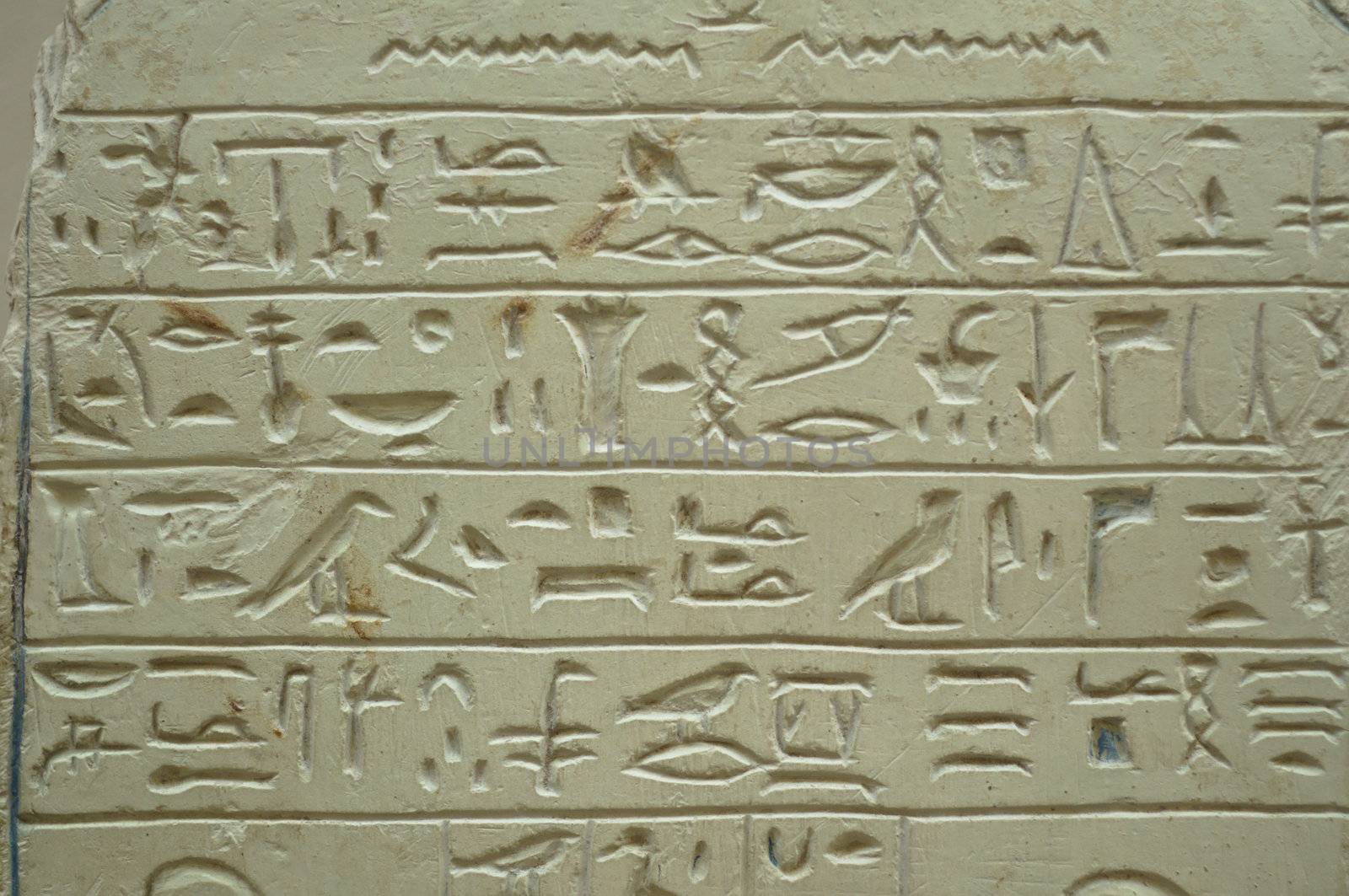 Ancient Egypt hieroglyph writing and sign on stone wall