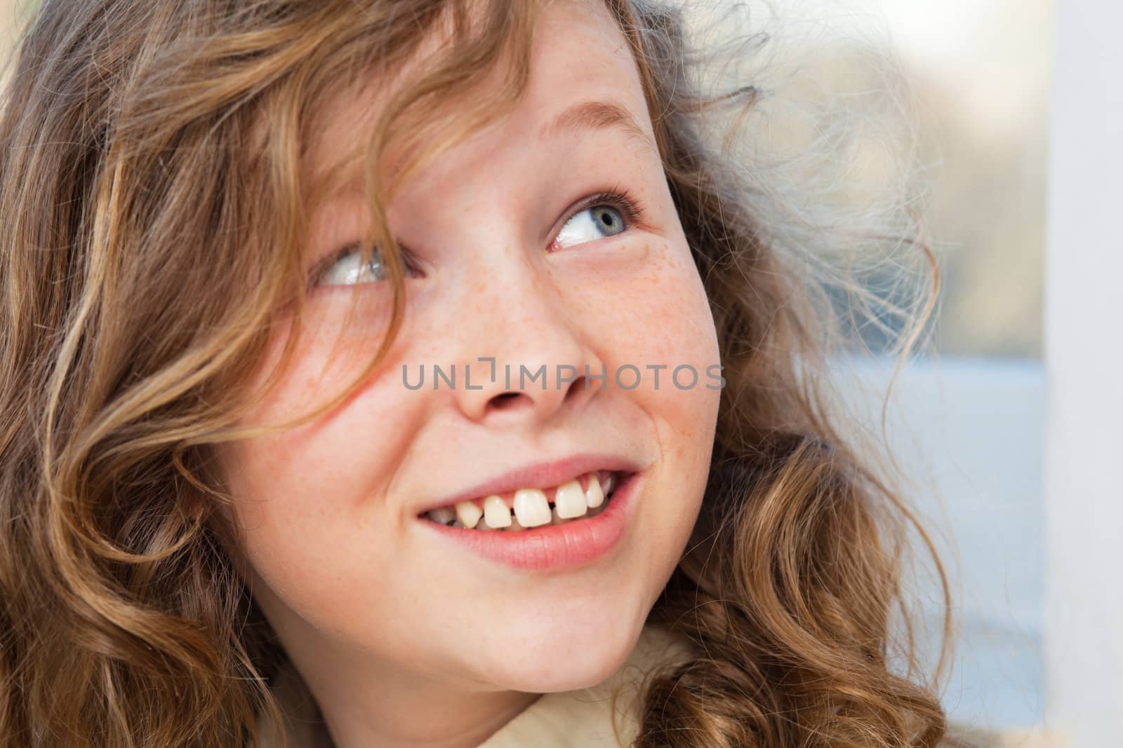 Closeup portrait of a cute teenager girl turning back