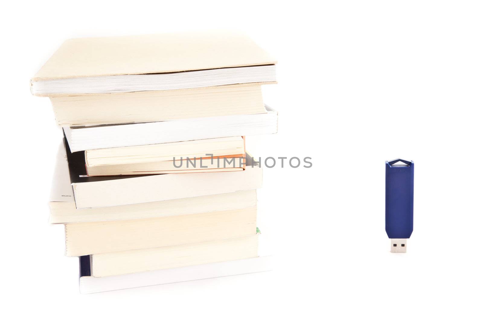 Concept of memories: blue usb key close to books