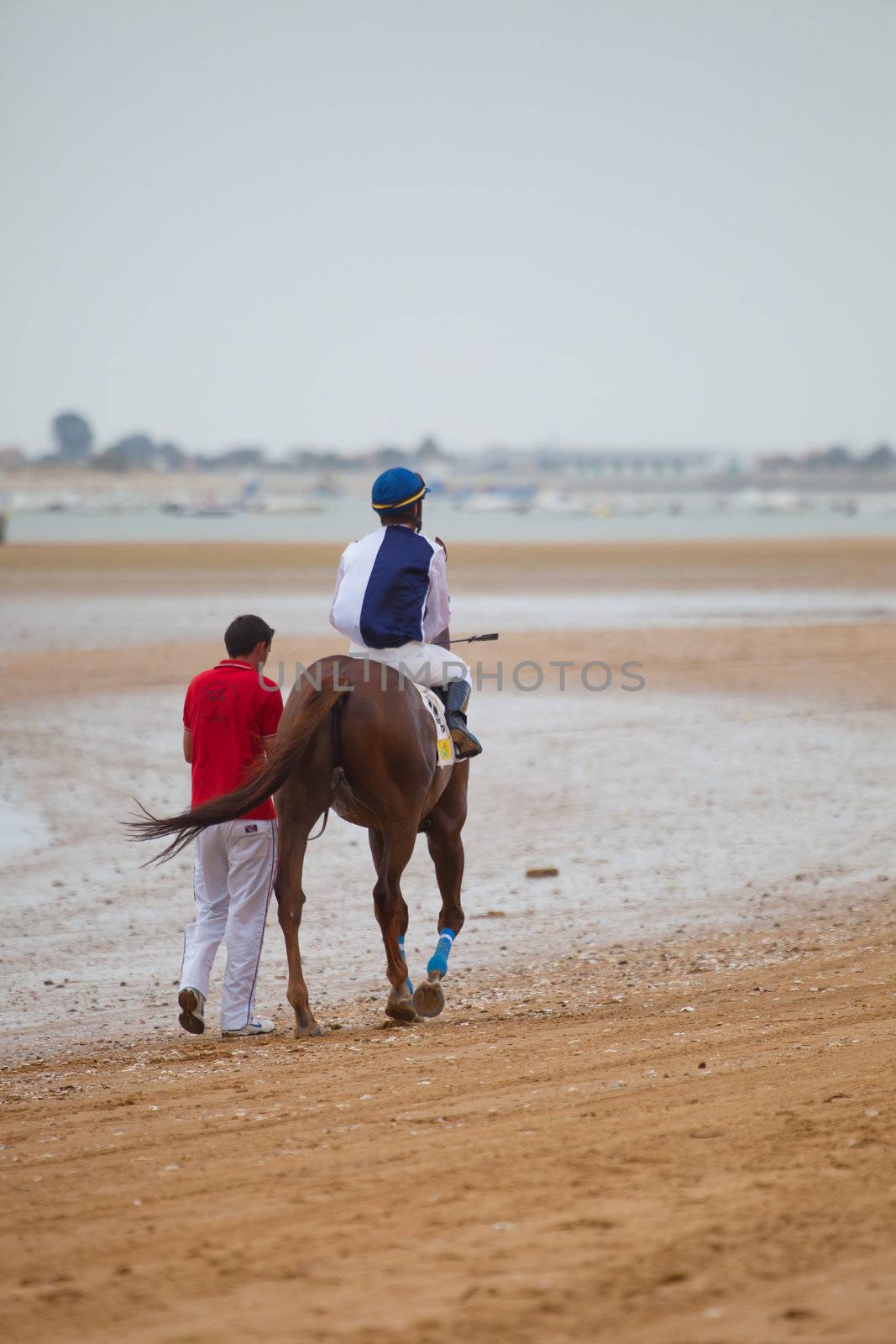 SANLUCAR DE BARRAMEDA, CADIZ, SPAIN - AUGUST 07: Unidentified rider at the start of race horses on Sanlucar de Barrameda beach on  August 07, 2010 in Sanlucar de Barrameda, Cadiz, Spain.