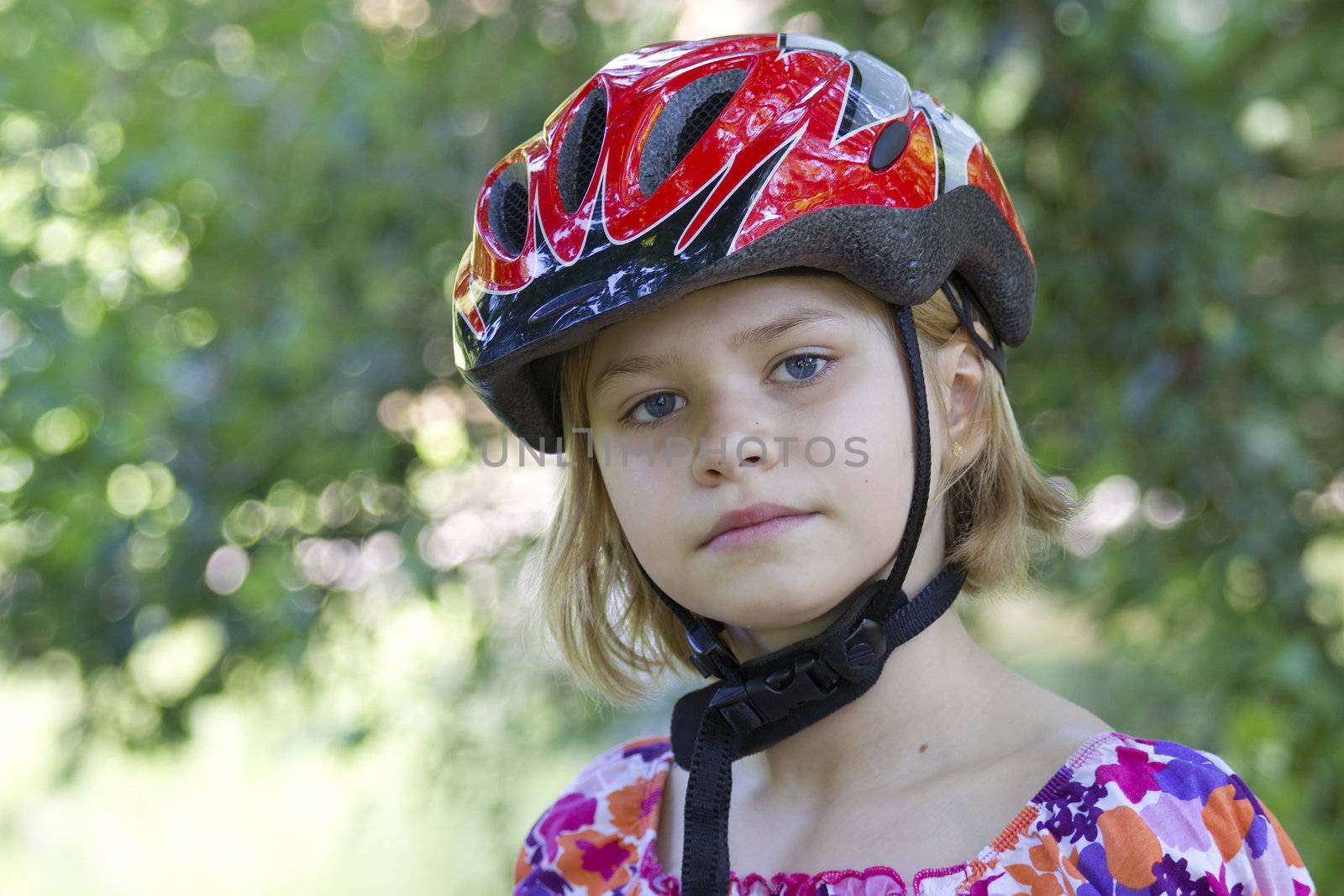 girl wearing a bike helmet 