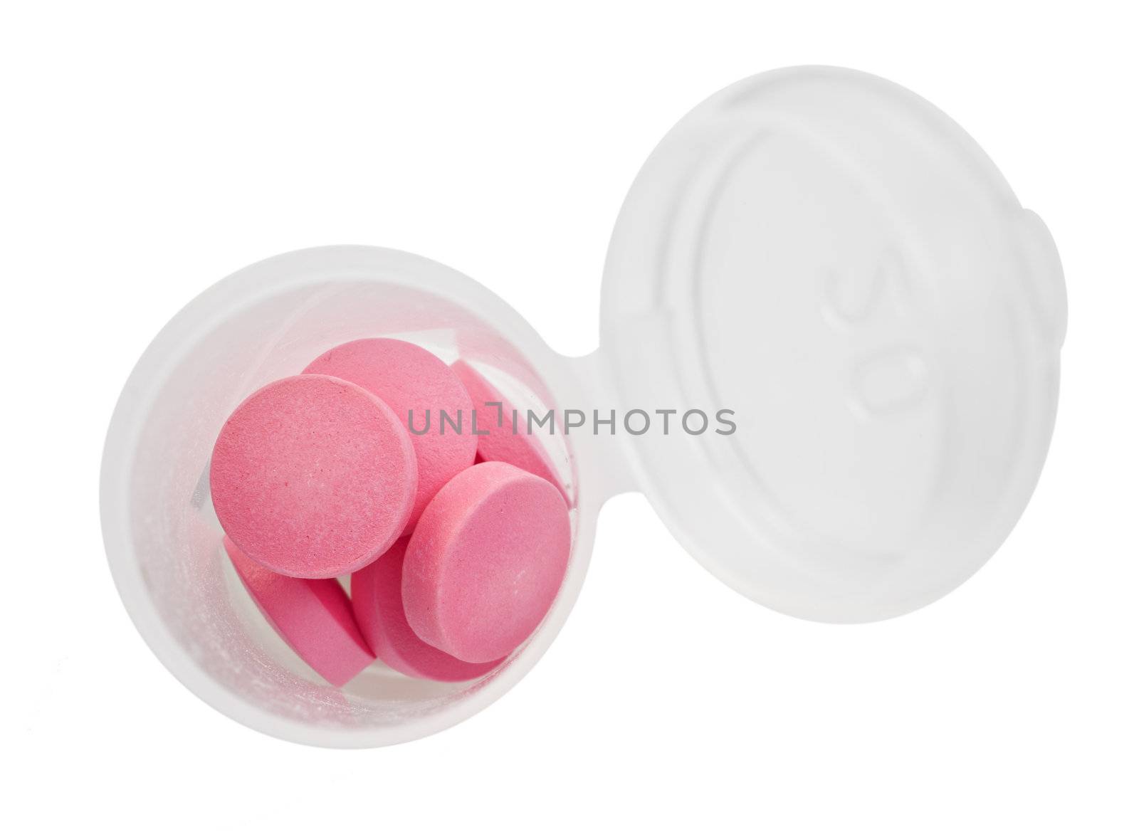 Pink pills and pill bottle on white background with space for text